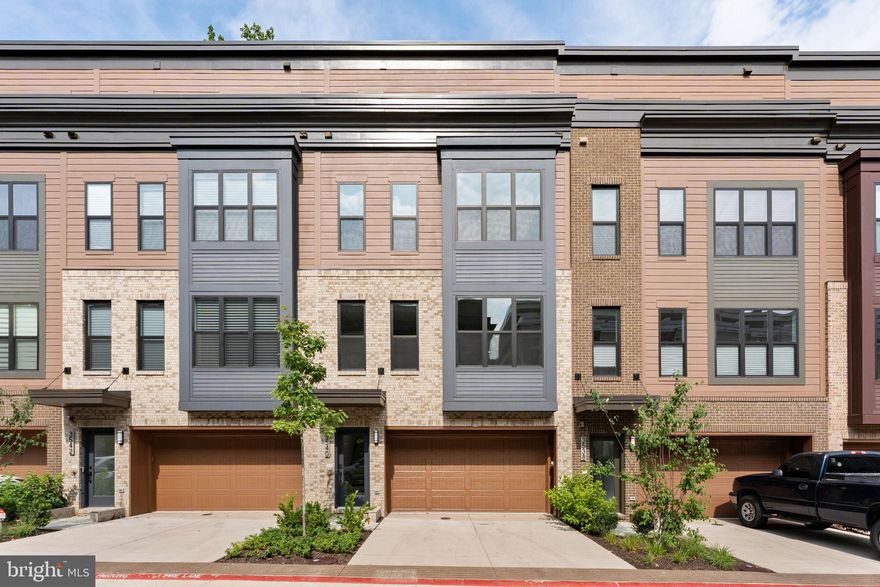 Fabulous views!! 4 level ELEVATOR!! Brand new, never lived in, contemporary townhome in a very coveted location overlooking the Army/Navy Country Club Golf Course. 4 finished levels. Open concept living, dining, kitchen, family room + large outdoor deck on the main level. The bedroom level has 2 primary suites, each with an en-suite bath and 2 large walk-in closets. On the 4th level there is a large loft/bonus room that opens to a roof top terrace with gorgeous views of the golf course. There is also a walkout lower-level recreation room that opens to a fenced and gated flagstone patio. Numerous luxury options include 7 ½” wide plank engineered wood flooring through-out, oak stairs with painted risers, deluxe level kitchen package with European style flat panel cabinetry, stacked to the ceiling, Bosch appliances, huge island with stainless undermount sink and filtered water, steel rail system on stairs at main and upper level, security system, wi-fi enabled keyless entry, primary bath with heated floors + more. Three separate outdoor areas all with stunning views of the golf course. 2 car garage plus driveway parking. Vacant. The builder, EYA, is sold out of this plan (The Cary) and is sold out of homes backing to the golf course. 
Sutton Heights is ideally located on the eastern edge of Fairfax City, just a few miles from the Vienna Metro, 495, 66, Tysons Corner, the Mosaic District and Fairfax Inova Hospital. Multiple options for shopping and dining are nearby. In addition, the 40-mile Cross County Trail can be accessed at the community ball fields just a short distance away.