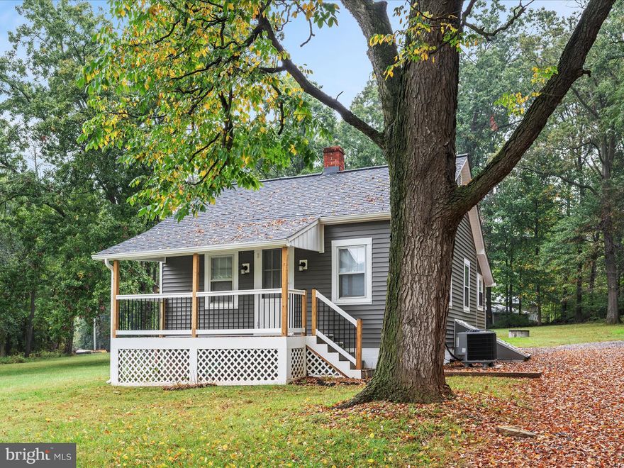Unpack & Relax in this Charming Cottage nestled in the heart of Loudoun Wine Country, offering a perfect blend of Comfort & Modern Living. With a Major Renovation completed in 2025, this home is move-in ready, offering relaxing views and amenities from both the covered Front Porch and the Rear Patio. The completely updated Bathroom includes a custom walk-in shower, new vanity and wall storage. The open combination Dining/Living area is anchored by refurbished original hardwood floors, creating a warm and inviting atmosphere. The newly built Kitchen boasts energy-efficient appliances, complemented by quartz countertops, luxury cabinetry, and a pantry for added convenience. Step outside to enjoy the extensive hardscape and private rear yard, perfect for Relaxation or Entertaining. The property spans 0.9 Acres, backing to trees and offering stunning Mountain & Pond views from the Front Porch. Located in a peaceful rural setting, you'll appreciate the tranquility while still being close to local amenities. This home includes lawn service, off-street parking and additional storage space, adding up to a convenient living experience. Embrace the charm and comfort of this delightful residence!