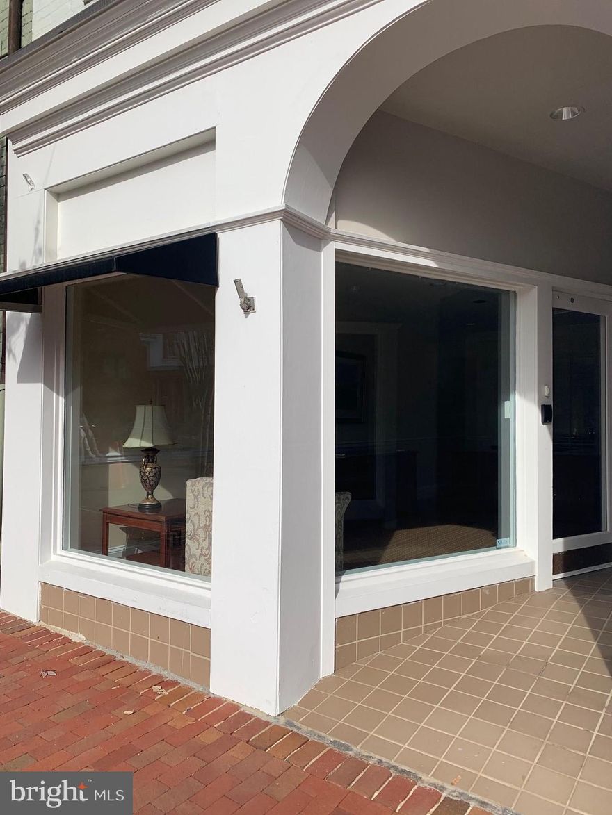 Lovely office space on Main Street offering great work environment and superb location.  This location offers high visibility with inviting entry and private offices and great working spaces.  Easy access to private parking spaces along with  Main Street parking and municipal lot parking as well.  Open and bright reception area with 2 private offices which have glass windows, 2 large cubical work spaces, work station and storage area.  Desks, chairs and filing cabinets are in place for your use.  Private half bath, refrigerator and rear exterior door to parking spaces.