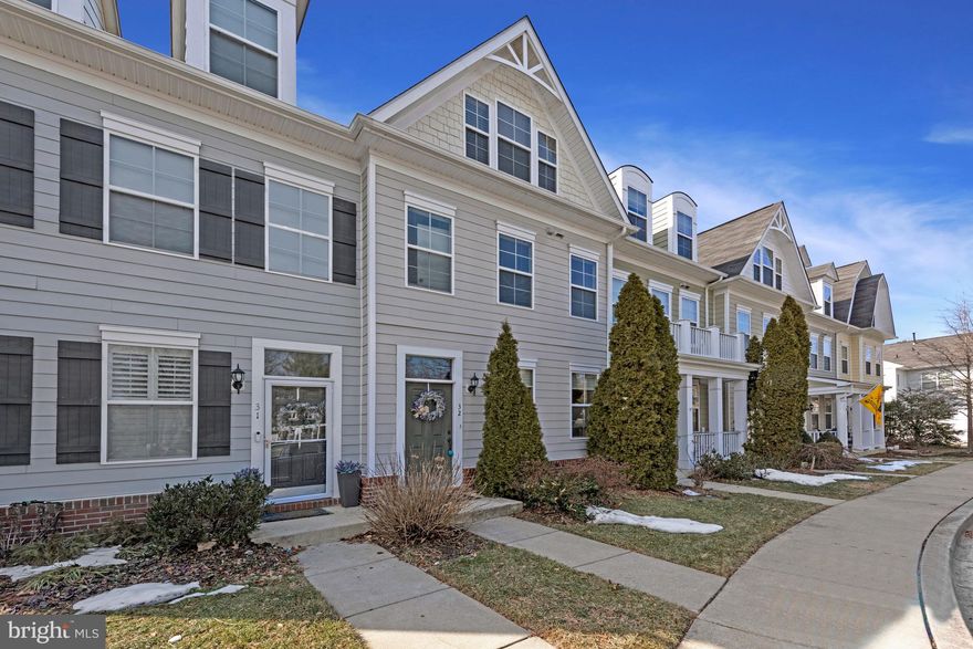 Nestled in the heart of Eastport, this beautifully appointed three-level townhome offers 2,600 square feet of inviting, light-filled living space designed to embrace you with comfort and ease. With three spacious bedrooms and 3.5 baths, every detail has been thoughtfully curated to create a home that feels both refined and wonderfully welcoming.

The open floor plan greets you with warm wood flooring and abundant natural light that flows effortlessly from room to room. The atmosphere is airy, modern, and uplifting. At the heart of the home, the gourmet kitchen features gleaming granite countertops, elegant 42-inch cabinetry, and stainless steel appliances. It is a space perfectly suited for lively gatherings, intimate dinners, and slow, cheerful mornings with coffee in hand.

The second floor is a serene retreat designed for both relaxation and everyday living. The spa-inspired primary suite offers a peaceful escape, complete with a luxurious bath featuring a glass-enclosed stall shower and a deep soaking tub that invites you to unwind at the end of the day. A generous walk-in closet provides both style and practicality. This level also includes a full additional bedroom and a beautifully appointed full bath, offering comfort and privacy for guests or family members. Adding to the ease of daily life, a full-size, quiet washer and dryer are thoughtfully located on this floor within a dedicated laundry space, making chores feel effortless and unobtrusive.

The third level offers even more versatility, with a charming mansard-style bedroom, a full bath, and a rooftop deck that feels like your own private sanctuary. It is the perfect setting for sunset conversations, morning stretches, or simply enjoying fresh air above it all.

Outside, a private back patio creates a cozy extension of your living space. The turf-like dog pad and direct access to the two-car garage with keyless entry add convenience while maintaining the home’s polished feel.

Beyond the beauty of this home, the location offers unparalleled convenience. The easy commute to Washington, D.C., and all points north makes work and travel a breeze, whether for business or pleasure. And for those who enjoy the boating lifestyle, Eastport is the ideal community. It’s a haven for boating enthusiasts, where the rhythm of the water and the excitement of yachting fill the air. Twice a year, the neighborhood comes alive with international boat shows showcasing the finest in motor and sailing boats—an exciting event that draws boating lovers from around the world.

This is more than a townhome. It’s a modern, cheerful haven where comfort meets style, with every space designed to support the life you love. From the tranquility of your home to the vibrancy of the community, this is where your next chapter begins. Come see it for yourself and imagine the life that awaits you here.