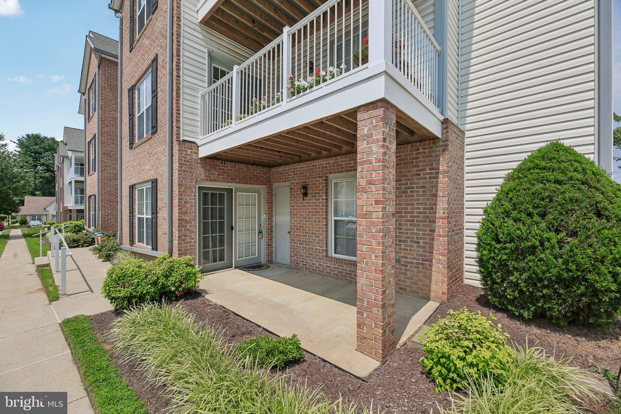 Welcome to this spectacular garden-level unit that's ready for you to call home! Featuring a large living room that has easy access to the patio which makes it easy to bring in groceries and items right from the parking lot, a spacious primary bedroom that's complete with an en suite, a second bedroom that's perfect for guests or a hobby room, an open kitchen with lots of counter space and cabinets, and so much more! Enjoy all that this 55+ community offers with a public gazebo and Community Center that's perfect for gatherings. Located conveniently near shopping, restaurants, and commuter routes, this condo is sure to impress!
