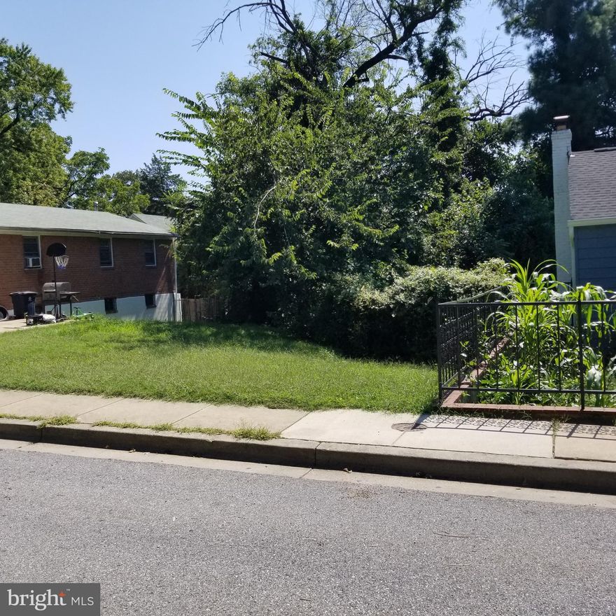 This partly cleared 4000sf lot is near the Capitol Heights Metro Station and one block from Washington DC. You can expect future development in this area which was rezoned for higher density.
RSF A zoning allows a 3 unit to be built here.  Ideal layout might be 2 stories with a walkout basement as the lower unit.
No sign on lot
The zoning may soon change to LTO-E