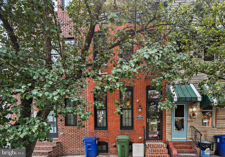 This Completely Renovated, 3 Bedroom, 3.5 Bath Canton Rowhome with Three Primary Bedrooms, Must Be Seen! Enter into the Bright & Airy Living Room with 9' Ceilings and Gleaming Hardwood Floors which continue throughout most of the Main Level. The Living Room features plenty of natural light, Exposed Brick, Crown Molding, Electric Fireplace with Mantle, Ceiling Fan and opens to the Dining Room. The Dining Area boasts a gorgeous wall niche with Exposed Brick. Continue to the Gourmet Kitchen and find Stainless Steel Appliances, Gas Cooking, Granite Counters, Granite backsplash behind the Range, two cabinet Pantries, Recessed Lighting, and Under cabinet lighting and above cabinet lighting. Next is the Bonus Room (or Home Office, Possible 4th Bedroom or Exercise Room) with Carpeting and access to the Rear Patio with 6’ Privacy Fencing.  A Half Bath and Closet Round out the Main level. Make your way upstairs to find the first Primary Bedroom with Hardwood Floors & Carpeting, Ceiling Fan, Walk-in Closet and spacious Primary Bath with Exposed brick, Tile Flooring and Tub/shower combination. The second Primary Bedroom features hardwood flooring and carpeting, Ceiling Fan, two large wall closets and ensuite Primary Bath with Dual Sink Vanity, Tile Floor, and glass door to the tub shower combination with custom tile surround. The door to the large Rooftop Deck is found on the upper level, enjoy city views from the deck as you entertain family & friends. The Finished Lower Level Features a Third Primary Bedroom with Carpeting, Full Bath with Walk-In Shower, Tile Surround and Tile Flooring. Updates to this fully renovated home include new HVAC, all ductwork, all drywall, windows, roof, paint, all appliances, and flooring (2016) and new Water Main from street to the home with a transferrable warranty (2022). This Gorgeous Renovated Canton Row Home is steps away from Canton Square, shopping, dining and all that City Living Has to Offer! Don't Miss It!