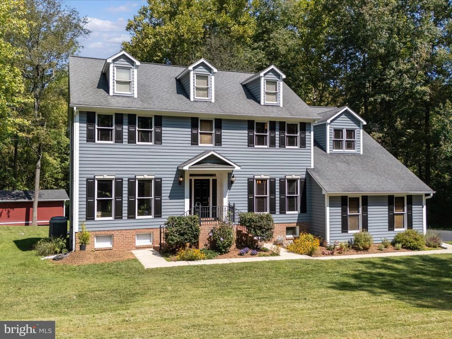 $50,000 PRICE REDUCTION ON THIS HOME THAT SHOWS LIKE A MODEL ON A PRIVATE 2 .2 ACRE LOT!
<br><br>
HOME DESCRIPTION 
<br><br>
Welcome to Your Private Retreat! This stunning 5,000 square foot, custom built estate sits on a
beautifully landscaped 2.2-acre lot, with ample yard, gardens and wooded lot providing privacy
on 3 sides offering both space and serenity. Queen Anne Estates is a low-density community
with all homes built on a minimum of 2+ acres, offering a neighborhood feel but with ample
privacy and tranquility.
PRIVACY, SPACE, CONVENIENT LOCATION
This home blends luxury, comfort, and functionality, tucked just off Rt 301 it is very close to
shopping, restaurants, parks, and major commuting routes for easy access to DC, Baltimore &
Annapolis via major arteries. A new Giant food market and a dozen retail shops are just minutes
away, and major big box retailers are within 5 miles. It features 5 BR, 4 ½ baths on 3 floors
totaling 5,000 sq/ft (4,600 finished sq/ft & 400 unfinished sq/ft.) 
The gourmet kitchen, complete with stainless steel appliances, granite counters, and a large deck just off the kitchen, is ideal for entertaining and outdoor dining. The family room features a vaulted ceiling,
skylights, and a new propane fireplace insert, all enhanced by gleaming hardwood floors
throughout. The primary ensuite boasts a brand-new spa-inspired bath and a generous walk-in
closet. A separate home office includes custom built-in-bookshelves, providing the perfect
work-from-home setup. The fully finished lower level offers incredible flexibility, complete with
a full bath, wood-burning fireplace, kitchenette with bar, microwave, dishwasher, and sink. The
glass slider provides easy access to a spacious patio and your private backyard oasis. Enjoy
additional features include ample parking in front of an oversized 2 car garage, a large
outbuilding with electricity that can be used as a studio, workshop or numerous other uses.
New Dual-zone industry leading High Efficiency Carrier Green Speed HVAC systems, oversized window, abundant natural light, peaceful landscaped surroundings on a quiet lot. From the moment you step inside, you’ll see why this executive home is truly a must-see!”