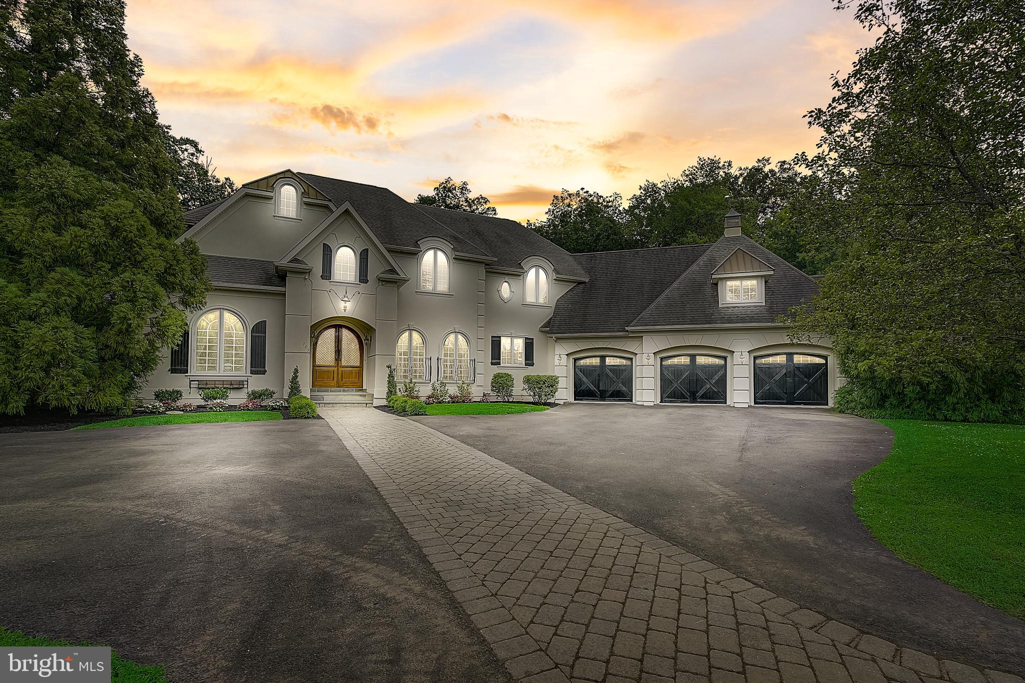 Don't miss this custom Gigliotti Manor Home perched on a sprawling 1.57 acre professionally landscaped lot in the private, boutique development of Greystone- complete with a large, scenic pond and water feature fountain views. Look no further for a move-in condition home that offers resort style living with old world charm- being offered with or without furniture for the best offer. The beautiful, custom exterior greets you with an expansive paved courtyard and handcrafted doors which lead to the open, 2-story Foyer and professionally decorated Living Room which boasts a magnificent limestone fireplace. The main level also features a Gourmet Chef Kitchen with high-end appliances and granite counters, as well as a Primary Suite with oversize Walk-In closet and Ensuite Bath. A Home Office with built-ins, Formal Dining Room and convenient Half Bath complete the first floor. The upper floor offers a large Sitting Room with built-ins, as well as 2 additional spacious Bedrooms with Ensuite Full Baths. The Walk-Out Lower Level boasts a state-of-the-art Movie Theatre, Wet Bar, Home Gym, and 2 Full Baths including an Ensuite Bedroom that could be used as an In-Law or Au Pair Suite. The huge rear deck overlooks the private, fenced-in yard and luxurious, sparkling in-ground pool. The 3-Car attached garage offers plenty of parking and storage and is even wired for Tesla car charging. The home is also wired for a security system, Ring doorbell system, and there is a WiFi enabled Lenox 2 zone HVAC system. Located just 35 minutes to PHL Airport & 90 minutes to NYC, the location can't be beat. Pre-qualified buyers are invited to make a reservation for a private viewing.
