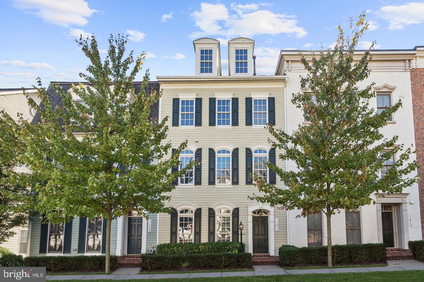 Pristine Miller & Smith townhome located in the amenity rich community of Maple Lawn. This well designed open floor plan includes a walkout living and dining area with a cozy gas burning fireplace, and a chef’s kitchen that features granite counters, 42 in. cabinets, double ovens, and a large island and breakfast bar under pendant lighting. The primary suite offers a walk-in closet and a luxurious en suite bath with a dual vanity, a soaking tub, and separate shower. A high cathedral ceiling with recessed lighting are accented in the top level loft creating the perfect setting for a spacious game room, in addition to 2 sizable bedrooms, both with walk-in closets, and a full bath providing optimal guest quarters. Enjoy outdoor living on the brick paver patio. The two car detached garage has plenty of additional storage.