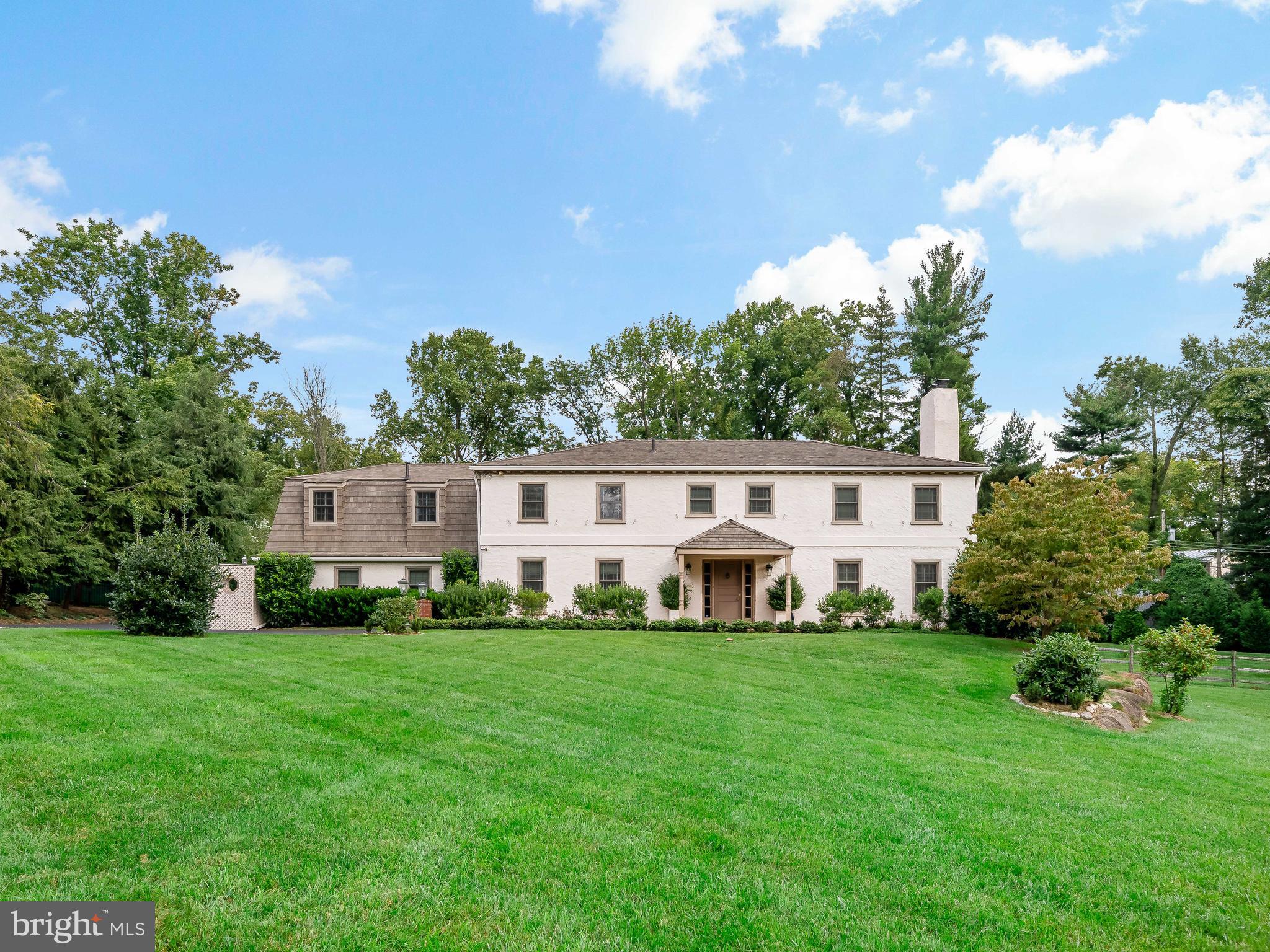 Located on a one of the most desirable streets of Northside of Villanova, you’ll find 1156 Red Rose Lane, a private and beautifully maintained colonial residence. With 5 bedrooms, 5.5 baths, ample indoor and outdoor space, a swimming pool, swimming pool changing and bathroom; 1156 Red Rose Lane is a wonderful place to call home. Sited well back from the street on a 1.33 level lot, its curb appeal is breathtaking. The impeccable landscaping and stately colonial style exterior elevate the home’s curb appeal. The charm and beauty continue with the covered entry and front door. Once inside, the foyer welcomes you to the spacious and bright first floor. Off the foyer, you will find the classic living room with a fireplace and dining room that feature updated hardwood floors. A full house generator and newer septic system offers peace of mind.
Continuing through this floor you’ll find the open and spacious kitchen. The space is well equipped with a large center island and plenty of cabinetry. It includes a Jenn-Air 6-burner electric cooktop, double Thermador wall ovens, a Sub-Zero refrigerator & freezer, Miele dishwasher, microwave & warming drawers and mini refrigerator. Adjacent to the kitchen is the lovely breakfast room with large windows that brighten the space and provide scenic views of the rear patio, pool area and grounds. The den has built-in cabinetry, shelving, decorative moldings, and windows to the rear. New windows on the front façade have been installed.
The kitchen/breakfast area opens onto the rear-yard and makes indoor & outdoor living easy. The expansive rear grounds are showcased by the gorgeous in-ground swimming pool and curved stone knee-wall, all surrounded by custom landscaping that enhance its privacy. The terrace is the perfect entertainment space for BBQs and summer nights. A powder room and laundry room complete the first floor.
The second floor includes a primary suite with oak flooring, convenient built-in wardrobe cabinets, an en-suite bathroom, and both walk-in and shoe closets. Additional oak flooring on this level has been recently installed. A completely renovated spa-like bathroom connects two spacious bedrooms. Two other bathrooms have also been exquisitely renovated and serve two additional bedrooms, one with built-in cabinetry. A rear staircase offers convenient access to the first-floor laundry area.
The lower level of the home has been completely transformed into a beautiful living and entertaining space, adding an additional 604 square feet. A large center fireplace is perfect for cozy movie nights. The wet bar with Caesarstone countertop and barstool seating is an ideal space to watch any big game. Enjoy the added convenience of outdoor access and additional storage.
This home has been meticulously maintained, recently updated, and cared for by its current owners. With its premium location and wonderful indoor and outdoor features, 1156 Red Rose Lane truly offers it all!