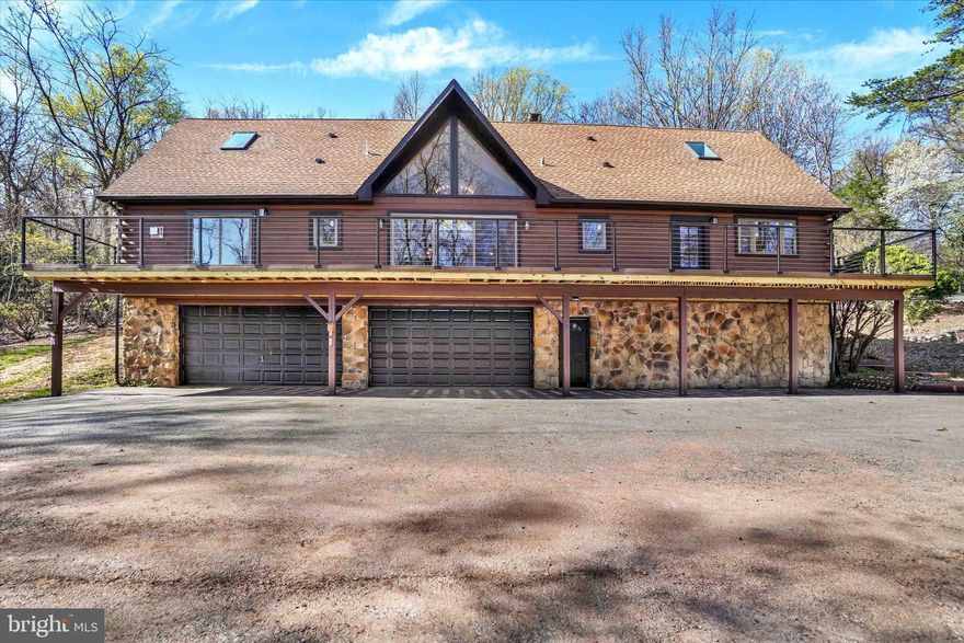 Mountain views! Stunning fully remodeled timber-framed log home on just shy of 5 acres in Dover!

Welcome to your dream retreat—this spectacular 3-bedroom, 4-bathroom log home blends rustic charm with modern luxury in one of Dover’s most serene wooded settings. Every bedroom has a private suite with its own full bathroom and walk-in closet, offering comfort and privacy for all.

Step inside and be wowed by the open-concept living area featuring soaring timber ceilings and a striking  fireplace with a pellet stove insert. The gourmet kitchen is a chef’s delight, with black leathered granite countertops, a sleek black tile backsplash, and seamless access to the 60-foot rear Trex deck—perfect for entertaining or soaking in the panoramic views. Enjoy the convenience of first-floor laundry, making daily living even easier.

The first-floor primary suite is a true sanctuary, featuring a spacious walk-in closet, cozy sitting area, and direct access to the deck, complete with a propane gas stove to keep you warm on winter nights. Step into spa-like serenity with this stunning, newly updated primary bathroom, designed with modern elegance and smart technology in mind. The show-stopping walk-in shower features bold, textured matte black tile, a sleek frameless glass enclosure, and a Bluetooth-enabled LED shower light—perfect for setting the mood with your favorite music and customizable lighting.

Upstairs, a versatile loft space offers the perfect spot for a second sitting area, home office, or kids’ play zone.

Situated on a fully wooded lot with a cleared walking path below, this home offers peace, privacy, and a connection to nature. The oversized 4-car attached garage which also has a pellet stove, provides ample space for vehicles, tools, storage, a workshop, and outdoor gear. Emergency generator conveys with property. 

This is more than a home—it's a lifestyle. Don’t miss your chance to own a piece of paradise in Dover!
