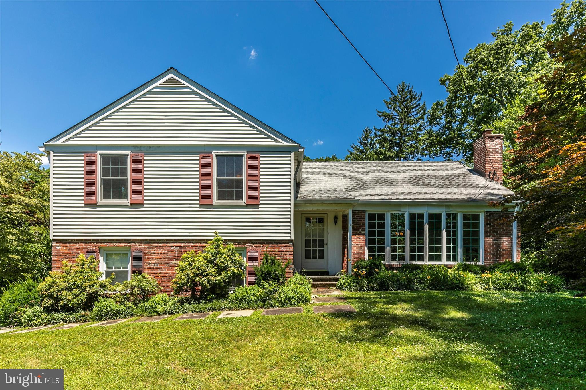 Plan your visit to this split level home in Wayne - Middle of the block location - Large level yard with trees and shrubbery - A short walk to St David's train station and just a bit longer jaunt to the shops, restaurants and businesses in downtown Wayne - Award winning Radnor School District - Three bedrooms - Two and a half baths - Large living room with oversized bow window and wood burning fireplace - Dining room with nice view of the rear yard - Big eat in kitchen with door to yard - The lower level has a well sized gathering room with another wood burning fireplace, a half bath and access to the patio - The laundry and mudroom is on this level too - The basement is unfinished but ready for your rec room or workshop space plans - There is a large walk up attic for your storage items or as a future home office or fourth bedroom renovation addition, a very popular and common upgrade with this style home - Two car garage with interior access - Low maintenance free brick exterior - Newer roof and replacement windows - Newer insulated garage door with opener - Gas heat - Newer Central air - Hardwood floors - Good closet space - Put your personal touches and upgrades in to this home and enjoy a very likely appreciating investment in a nice and stable community with a great history - Home being sold in AS-IS condition - Buyer responsible for any township Use & Occupancy items but believe things are in good shape there - CLICK THE OLD TIME MOTION PICTURE CAMERA FOR VIRTUAL TOUR & GREATER DETAIL ...