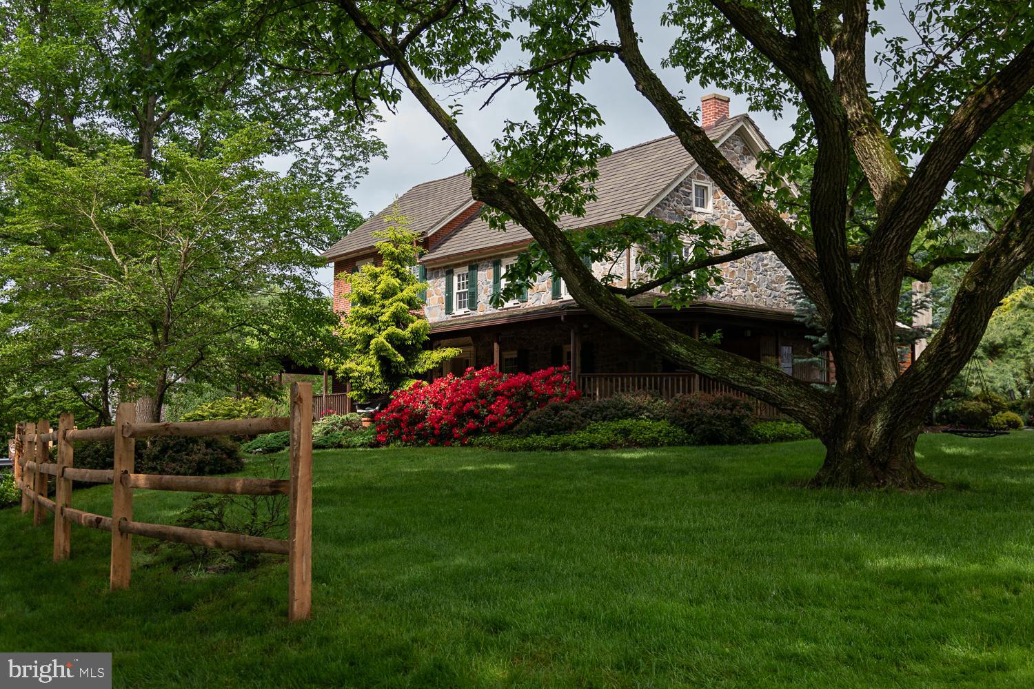 Welcome to 4217 Mill Road, also known as Les Bocages d'Chatain (The Grove of the Chestnuts)—a charming 12-acre estate nestled in the heart of Coopersburg, offering the perfect balance of history, comfort, and natural beauty. For the past 38 years, this beloved farm has been thoughtfully cared for by the same owners, and now, it’s ready to welcome a new chapter.
Steeped in history, the property was once part of the Yoder homestead and boasts a farmhouse built circa 1880, full of character and timeless appeal. Every corner of the 4635 sf home tells a story, with deep window sills, stone accents, wide plank hardwood floors, and original built-in farmhouse cabinetry. While thoughtfully updated with modern amenities, the home's rich historical charm has been preserved.
This extraordinary property features an impressive collection of outbuildings, each brimming with character and functionality. At its heart stands a magnificent three-level, circa-1800s Bank Barn, a true architectural gem showcasing timeless charm. From its hand numbered beams to its multiple horse stalls and stone façade, this barn is a stunning testament to historic craftsmanship. For the car enthusiast, the modern three-car garage is a dream come true. Not only does it provide ample space for vehicles, but it also includes a fully finished office space above, complete with electricity and heating—perfect for a private retreat or workspace.
Additional outbuildings offer even more versatility, including a spacious tractor shed with a second-floor loft, a classic smokehouse, and a functional greenhouse. Each structure adds to the property's rich history and practical appeal.
Beyond the buildings, the landscape is equally breathtaking. A serene, oversized pond invites peaceful afternoons with a picnic, while a picturesque stream meanders through the property, nurturing a thriving ecosystem of native wildlife and lush vegetation. The home’s back paver patio is a true oasis, featuring a charming gazebo, a tranquil pond, and thoughtfully designed landscaping. Adding to the property’s uniqueness is a rare grove of American Chestnut trees, a remarkable nod to the land’s natural beauty and heritage.
With its unparalleled blend of history, modern convenience, and breathtaking scenery, this one-of-a-kind property is a rare find in a fantastic location!