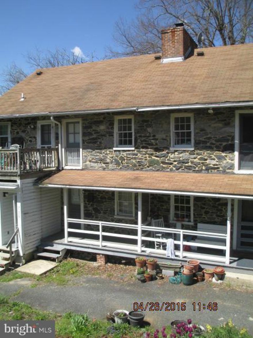 Attractive, updated home with recessed lights, exposed stone walls, fireplace, covered porches, modern kitchen, wood floors, parking.  Wonderfully serene location with hillside views.  Sold as-is. Seller only reviews offers from non-profit organizations for the first 14 days on the market. On the 15 days, offers are considered from owner occupants and investors.