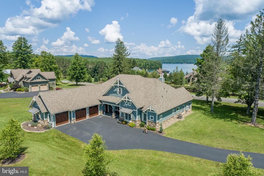 Elegant Lake Access Craftsman in the prestigious Reserve at Holy Cross! Constructed by Westmar Builders in 2018, this 4Bed 3.5Bath home is situated on over an acre of manicured land and features almost 3500 sq ft of luxurious living space complete with a modern gourmet kitchen, vaulted great groom ceilings, two hearthy stacked stone fireplaces, and an abundance of natural light to compliment the crisp clean yet homey feel. Stainless commercial kitchen appliances with massive island, granite tops and an expansive hidden pantry. Three fully tiled en-suite bathrooms and timber accents throughout. Additional Den with wet bar adds the perfect extra space for entertaining guests, or gather out on the sprawling patio and soak in the views of Deep Creek Lake! Of course – you’ll enjoy the hot tub year round. Oversized Three car garage offers plenty of space for all your vehicles and outdoor toys. Perfect for full time living or your private mountain lake retreat, this home is a must-see work of art. Seller requires an up to 12 Month Rent Back option for any accepted offers. Don’t miss your chance to see this one of a kind abode in one of Deep Creek’s most sought after communities… Call today for details!