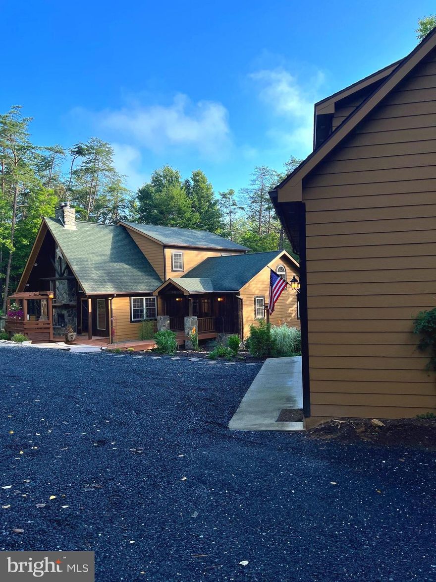 "Hidden Gem" Double lot! This home is exceptional - 3 Bedrooms/2.5 Baths -  Open floor plan - Beautiful home with detached garage with upper finished level with ½ bath - Extensive landscaping with fire pit - Outside wood burning fireplace on front deck to enjoy the cool evenings outside with family and friends – There is a stone wood burning fireplace inside living room – Kitchen has stainless steel appliances - Screened in porch - Decks – Just minutes to the indoor pool at Bryce Resort.