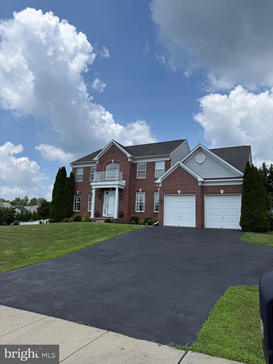 New, NEW PRICE REDUCTION. SEND YOUR CLIENTS OFFER. Situated on a spacious 0.43-acre corner lot in sought-after Manchester Farms, this 4-bedroom, 2.5-bath !Yorkshire Colonial home blends classic charm with modern upgrades. Its main level features a formal dining room with new hardwood floors and crown molding; a bright, carpeted living room; and a versatile den perfect for a home office, gym or playroom. Its eye-catching family room boasts 20-foot ceilings and a floor-to-ceiling stone fireplace, while the kitchen offers an island, table space, and sliding doors to a private patio. Upstairs, the luxurious primary suite includes a walk-in closet and spa-like bath with a jetted tub, dual sinks, and all-new finishes. Recent upgrades include new hallway flooring (2025), first and second floor HVAC systems (2022 and 2025, respectively), a water heater (2025), and a fully finished garage with AC—currently used as an entertainment space! With its prime location near commuter routes and move-in-ready condition, this home won’t last. Schedule your showing today!