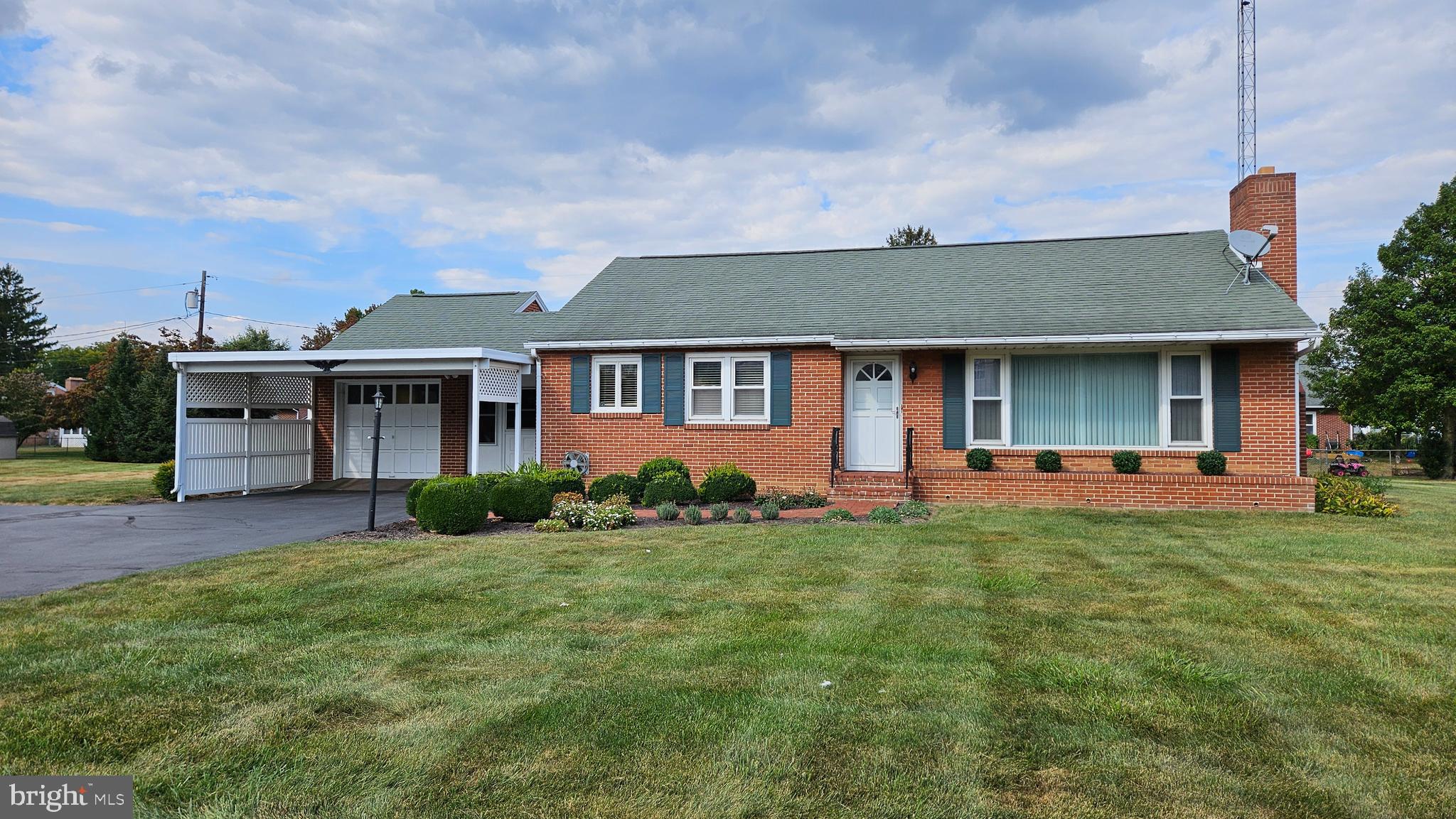 "DREAM COME TRUE" brick rancher with new kitchen! This house has sharp looking cabinetry throughout including bath and dining hutch combo. All appliances stay with sale, solid surface counters. Beautiful hardwood floors have been redone. 2 large bedrooms plus lots of closet space. Wood burning, brick fireplace. New roof, 2012. Newer 16x12 Esh shed at rear yard for storage. Attached 1 car garage w/enclosed entry area breezeway that transitions to rear porch! . Meticulously cared for, very nice condition! Convenient to shopping, North Guilford Hills location!