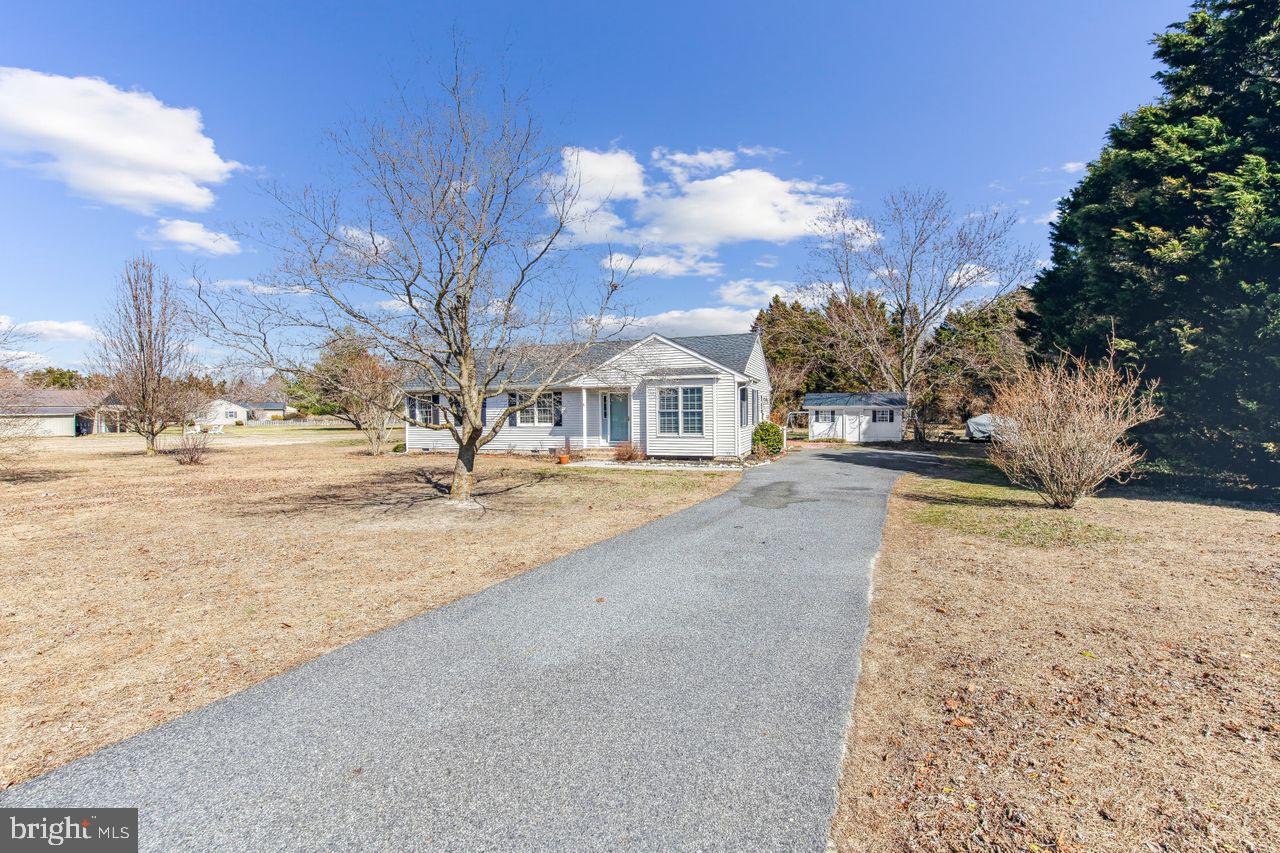 You will love this beautiful 3 bed, 2 full bath home situated on almost an acre of land in the sought after community of Hunter's Mill. Enjoy relaxing on the back deck overlooking a large yard perfect for entertaining. This home features a master suite, large eat-in kitchen with cathedral ceilings and newer stainless-steel appliances. There are many updates including new carpet, fixtures, water heater, water conditioner, newer LVP flooring and back deck. There is a floored attic that is the length of the home for extra storage. The paved driveway has plenty of parking. There are two storage sheds on the property. Come see why this home could be perfect for you! *Professional photos coming soon.