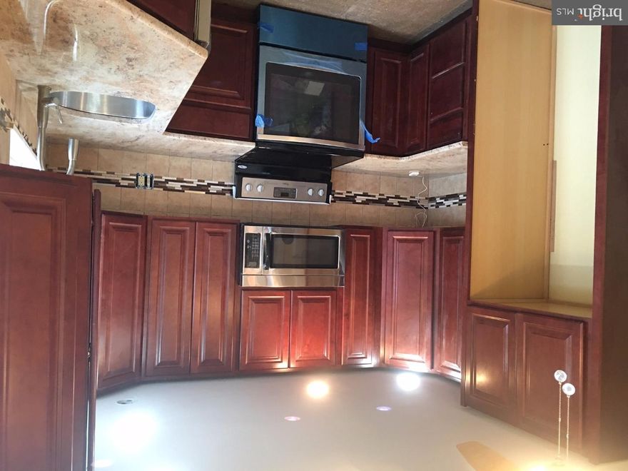 Welcome Home! Be the luckiest buyer(s) to purchase one of the best deals in Mt. Airy East.  From the moment you enter this twin, you will notice a well done renovation project with brand new windows, refinished hardwood floors, neutral color paint, brand new kitchen with 42" cabinets, designer backsplash, granite countertops, new ceramic tiles, luxurious remodeled bathrooms, finished basement, new security doors, new roof, new energy efficient heater, new cement steps and located on an outstanding block. No backyard residential neighbors.  Rear driveway accessible from Stenton Ave as well as Mansfield Ave.