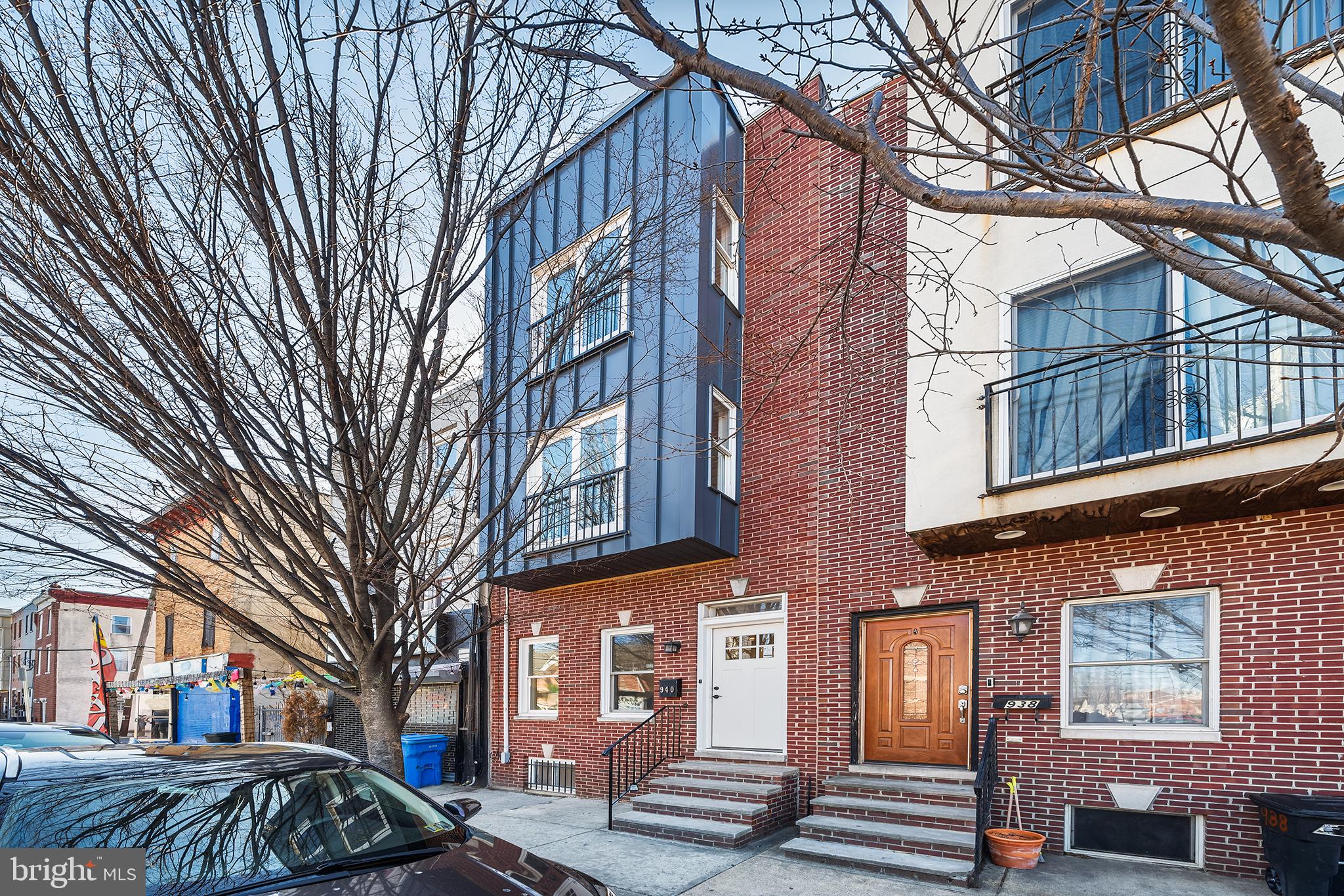 Welcome to 940 S 5th Street, a stunning home in the heart of Queen Village. This newly renovated home offers 3 bedrooms, 2 bathrooms, and 1,794 square feet of living space. Originally built in 2007 and now fully reimagined in 2025! Step inside and be greeted with engineered hardwood floors, recessed lighting throughout, high ceilings, and large windows allowing tons of natural light. The chef’s kitchen features stainless steel appliances, subway tile backsplash, white cabinetry, and a waterfall island perfect for barstool seating. Step outside to the back patio perfect for entertaining guests in the summer months! The second floor includes 2 spacious bedrooms and a beautifully updated full bathroom. The entire third floor is a luxurious primary suite, highlighted by a sun-filled bedroom, spa-like bath with a glass-enclosed walk-in shower, and a private deck. From there, a spiral staircase leads to a rooftop deck with stunning skyline views! The fully finished basement offers extra storage space and additional space for a home gym, home office, or secondary living space. Easy access to I-95 and public transportation and just minutes away from Queen Village favorites like Shot Tower Coffee, Royal Sushi & Izakaya, and the Italian Market. This home is in a perfect location, schedule your showing today! Offering a BUY DOWN through Movement Mortgage. Reach out to co-listing agent for more info!