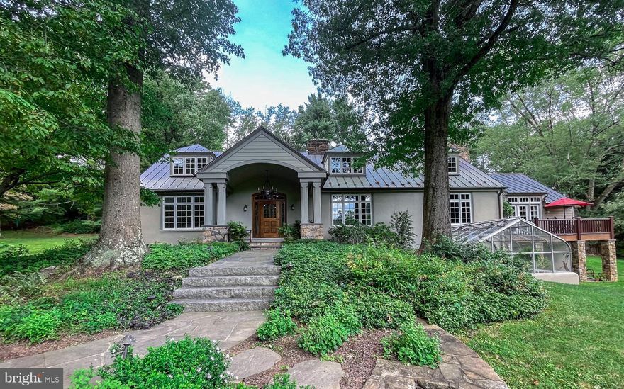 Homes like this do not come on the market often. 1045 Lower Pine Creek is a stunning private oasis that has been completely renovated by renowned architects Archer and Buchanan.  The home features two primary suites; one on the first level with vaulted ceilings, ensuite bath, radiant floor heat, walk in closet, hidden jewelry cabinet and private deck overlooking the pond and creek.  The second primary suite is located on the upper level with the same majestic views, private sitting room and its own ensuite bath... choose which makes most sense for your lifestyle. 
Besides the first floor primary suite, the first floor has a chef's kitchen with large island, granite counters, double sink and high-end appliances,  a breakfast room, a large dining room with built ins, a large office with Spanish cedar wainscoting and built ins and a Rumford fireplace, a living room, a powder room, a laundry room with plenty of storage and a spacious family room with a wood-burning fireplace. The family room has French doors that lead to an outdoor oasis with patio, gazebo, gorgeous gardens and a heated saltwater pool with fountains and lighting.
The second floor features the second primary bedroom with ensuite bath and sitting room, two other oversized bedrooms, a hall bath and a library loft.
The lower level features a wonderful "pub"room with a wet bar with copper counter, Subzero wine fridge and Subzero mini refrigerator, built in table perfect for game night, a full bathroom complete with raised tub (perfect for pets), walk in fireproof safe room....radiant floor heating runs throughout the lower level rooms. There is also a large family room with built ins, wood burning Rumford fireplace and French doors that lead to a patio and pond beyond.  The lower level also features a greenhouse, a potting room, large workshop, and and oversized garage with 240V outlet and Kinetico home water system.  There is also a security system and a whole house generator.
Outside enjoy the over 10 acres of land with outdoor amenities including  the heated saltwater pool with fountains, gardens, the pond and creek.  Take a walk over the "Monet" bridge or the two bridges crossing Pine Creek.  The property is magnificent and it offers lower taxes due to ACT 319.  
Welcome Home!