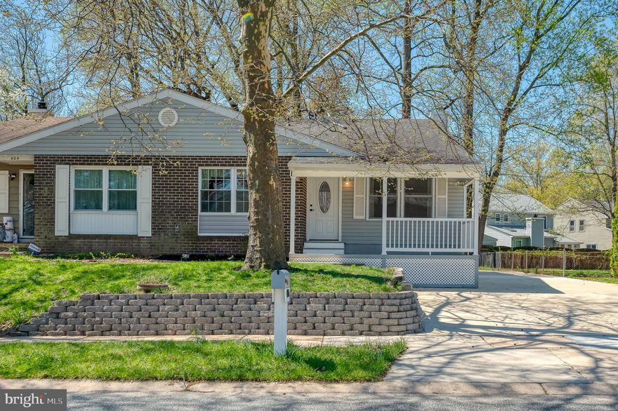 Welcome to 406 Laburnum Road, an updated split foyer that is move-in ready! The main level features new luxury vinyl plank flooring (2026), fresh paint, and an open living and dining area. The kitchen includes brand new countertops and a large window for natural light. Upstairs, the spacious primary suite addition offers high ceilings, a walk-in closet, and a private full bath. Three additional bedrooms - one with its own attached half bath - and another full hall bath complete the upper level. Ceiling fans are in each bedroom as well as newer carpet. The finished lower level includes LVP flooring (2026), a fireplace (needs insert), laundry, storage, a half bath, and access to the finished garage -ideal for parking or a flex space with heat/AC and multiple outlets (ideal for workshop or game room). Major updates include an 18 SEER Carrier heat pump with UV air purification (2022), roof (2016), and R-6 insulated garage door. Enjoy a new and welcoming front porch (2016), level rear yard, patio, and shed. Conveniently located just off Edgewood Road in the Willoughby Woods Community, this updated home offers modern finishes and flexible living space.