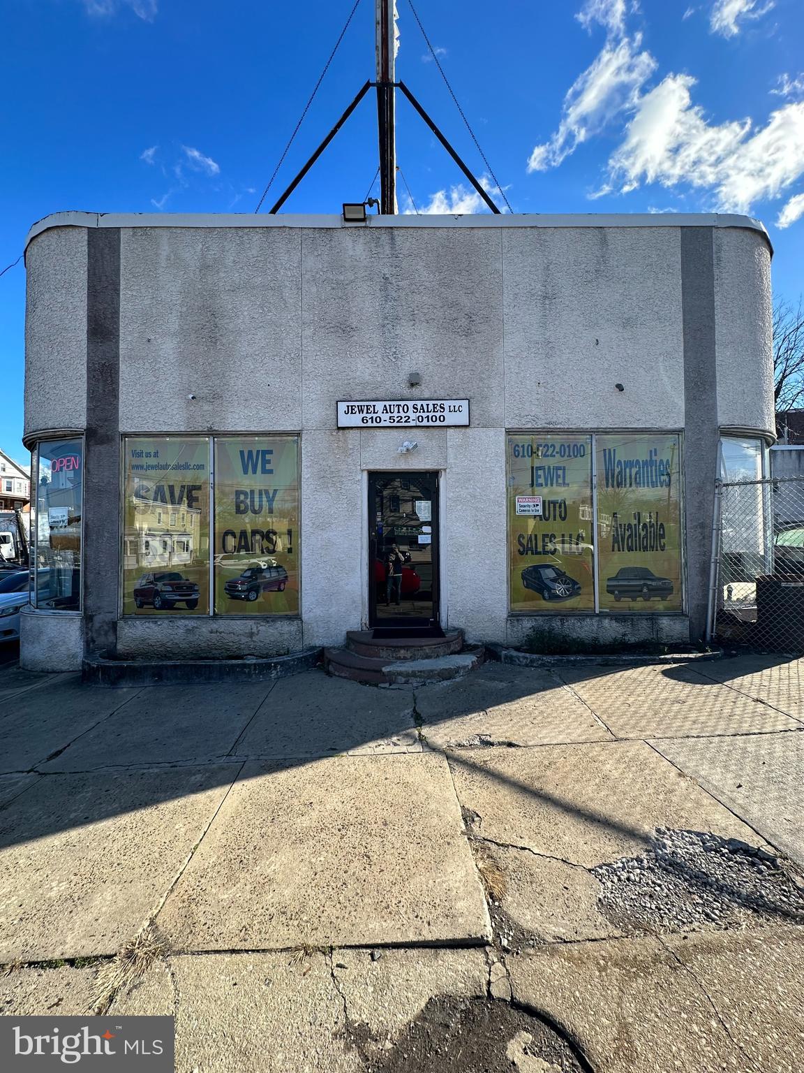 Welcome to this auto car lot in Darby, PA! This prime property offers a fantastic opportunity for automotive business owners looking for a high-visibility location. Step inside to explore the showroom, complete with 6 offices that provide ample space for conducting business and showcasing vehicles. The interior offers a professional setting for meeting with clients and displaying your inventory. Outside, the property features +-250-foot frontage on Chester Pike with lighted 22x6 billboard, ensuring that your business will receive maximum exposure to potential customers. With space for 50-60 cars, there's no shortage of room to showcase your vehicles and attract attention from passersby. Additionally, the property includes a 5 bay service facility attached, which is currently leased month to month and can be delivered vacant if desired. This added feature provides an excellent opportunity for additional income while complementing your automotive business. Don't miss out on the chance to make this impressive auto sales car lot the new home for your business. Schedule a viewing today and take the first step towards elevating your automotive enterprise to new heights!