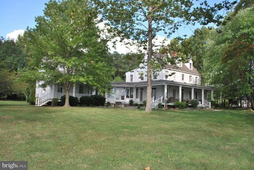 ANOTHER HUGE REDUCTION!  Epitome of laid-back cool.  5BR, 3.5BA gem located on 21.5 acres fronting Herring Creek. While looks historic, house offers all updates of a new home. Wide welcoming front porch opens to the large LR w/ crown molding, FP, hardwood floors,  DR w/ FP,  renovated kit, sun room, and a huge great groom--all make this property perfect, even private long dock. Best deal around.