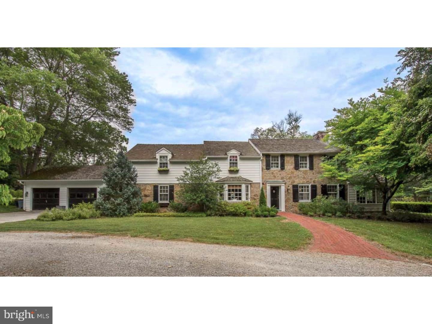 Refined PA stone farmhouse in sought after area of Easttown Township and the award winning T/E School District. Turn down a private lane and circular drive to arrive at this 1948 farmhouse situated on a flat, beautiful 1.5 acre lot. This home has been lovingly added onto over the years, making it a unique blend of old and new, ready for today's sophisticated buyer. The brick walkway leads up to the front door and foyer with random width pegged wood floors and turned staircase. A formal sitting room with bay window leads to a sunken library/living room with built-in custom entertainment cabinet flanked by bookshelves and window seats. The breezeway with large rear windows and french doors connects the garage, side entry and access to the rear stone patio with pergola, hot tub and fire circle. Pass through the Butler's pantry to enter the open concept kitchen and family room. The updated kitchen has an L-shaped breakfast bar, granite counters, marble backsplash accents, stainless steel appliances include double ovens, a new Maytag 5 burner gas cooktop, dishwasher and wood paneled Subzero refrigerator. The kitchen opens to the family room with eat-in table, black granite surround hearth gas fireplace and custom painted wood entertainment mantle. The side door has direct access to the kitchen garden and double french doors provide another access to the rear patio, hot tub and fire ring. A formal dining room is at the front of the home with double front and rear windows, gas fireplace, brick hearth and custom wood front, mantel and dentil moldings. Off of the dining room is a sunroom, currently used as an office, with cathedral ceiling, interior stone wall and 3 sides of windows overlooking the gardens. The second floor consists of the master bedroom suite with dressing area, and master bath with ceramic tiled shower, tub and cultured marble double sink vanity. Down the hall are two other large bedrooms, laundry closet, and hall bath with oversized shower, tub and vanity. Tucked away, the forth bedroom has an ensuite bath ideal for guests. There is also a partially finished basement with ceramic tile floor, and an attached 2 car garage with extra storage space. The home sits on 1.5 acres, fully fenced with a kitchen garden and raised beds, PA Bluestone patio with pergola, large recessed gravel firepit and gardens. All of this and award winning TE Schools. Welcome home to 1223 Sugartown!