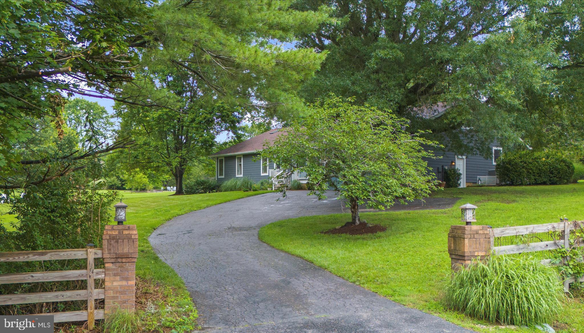 OPEN HOUSE SAT 12-3:30PM,
Renovated main-level living
Don’t miss the 2-level barn –dream workshop on main level , studio upstairs (potential ADU)
Space for pool
This beautifully updated 3-bedroom + office home offers stylish, easy living on one level with high-end finishes throughout. The detached, two-level barn features a light-filled studio above and a fully powered workshop below—ideal for creatives, professionals, or hobbyists.
Set on 2+ acres, the property blends refined living with peaceful outdoor experiences. Relax or entertain in multiple outdoor spaces—including a blue flagstone patio, irrigated raised garden beds, a lily pad pond, and a whimsical wooded fairy garden with a swing. Enjoy a picnic under the multiple fruit trees including cherry, apple, and pear.
Inside, vaulted wood ceilings (up to 13 feet), a feature fireplace, and a wall of glass overlooking the blue stone patio elevate the open-concept living space. The kitchen impresses with new quartz countertops, stainless steel appliances, double oven, warming drawer, reverse osmosis water system, and pantry wall.
The spacious primary suite includes a walk-in closet and brand-new luxury ensuite bath. Two additional bedrooms, a dedicated office/flex room, oversized 2-car garage with walkable attic storage, and multiple outdoor seating areas complete this rare offering.
Additional upgrades include Hardie board siding, roof, and skylights. There’s also room for a pool or potential ADU.
A rare blend of privacy, functionality, and designer upgrades—all with easy access to Annapolis, D.C., Baltimore, BWI, and the Bay. Close to golf, boating, restaurants, and shopping.