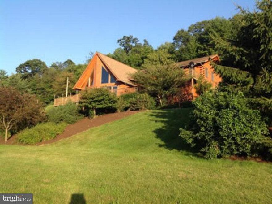 Log home - like new with new furnace, finished basement rec room & wet bar, patio, main level has 1 bedroom/office, stone fireplace, wrap around deck with beautiful view of the luscious landscaping & valley views. 2nd floor has 3 bedrooms, master bath & upper deck. All logs just re-stained & treated.