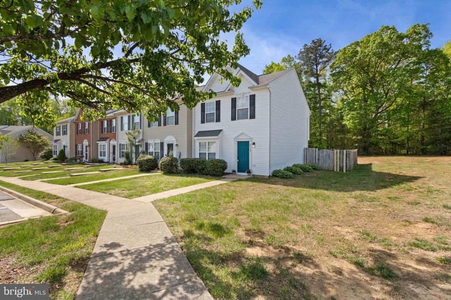 Welcome home to your charming 3-bedroom, 2-bathroom townhome nestled in the heart of a vibrant community! Close to shopping and dining in the Fredericksburg Southpoint area, and minutes from a VRE station and commuter lots, this property is at a prime location.
The spacious living room has beautiful natural light, ideal for entertaining and the offset nook would make for a great reading-corner or play area. The kitchen has so much space! Lots of counterspace and tons of cabinets, as well as room for a nice-sized kitchen table. Almost all appliances are new, as well as the washer. Enjoy a quick bite or invite friends over for a cookout – you have enough room! Enjoy the backyard and fire up the grill on those warm Virginia days – your large patio is perfect for relaxing. The fully fenced yard offers lots of privacy and backing to trees gives a nice view as well! Being an end-unit offers added yard space and open green space as well!
Upstairs you will find 3 bedrooms – the primary bedroom has lovely, vaulted ceilings and a private bathroom. Bedrooms 2 and 3 share the large hall bathroom. All bedrooms feature overhead lights and upgraded blinds. The entire homes has been freshly painted. Carpets are only 2 years young! Water heater  2022 and heat pump replaced in 2017.