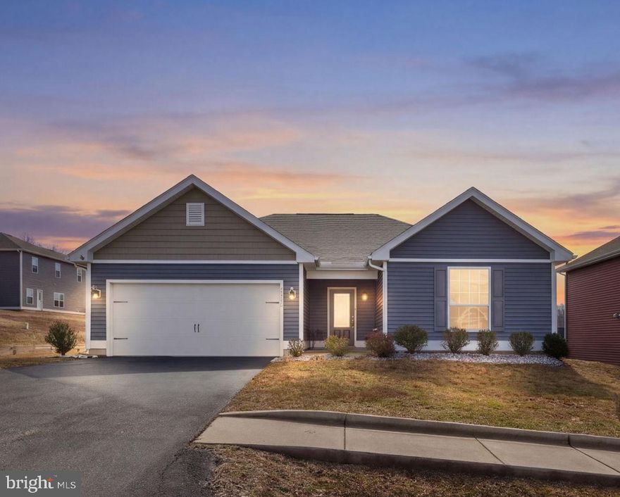 This charming and well-maintained home offers the perfect blend of modern comfort and small-town living. Built in 2020, the home features an open and inviting floor plan designed for both everyday living and entertaining. Step inside to a spacious foyer that provides the perfect landing spot for coats, bags, and everyday essentials. The heart of the home is the open-concept kitchen, complete with a large center island, ample cabinet space, and plenty of room for cooking and gathering. The kitchen flows seamlessly into the dining and living areas, creating a warm and functional space for family and guests. The large living room is bright and welcoming, featuring a vaulted ceiling that enhances the open feel of the home and fills the space with natural light. The dining area leads directly to the patio, making indoor-outdoor entertaining easy—perfect for hosting friends or relaxing outside after a long day. The primary suite offers a private and comfortable retreat, featuring two walk-in closets and an ensuite bathroom with a soaking tub and separate shower. Two additional bedrooms feature brand-new carpet and share a spacious full bathroom. Additional highlights include a convenient laundry room located just off the garage, adding everyday practicality and ease. Located in the charming town of Bowling Green, this home offers a peaceful setting while still providing convenient access to local shops, dining, and major routes for commuting.