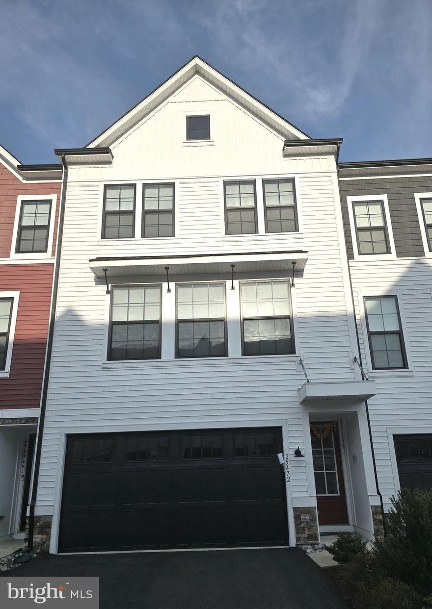 Welcome to 25472 Nichols Orchard Terrace, a stunning 4-bedroom, 3.5-bath luxury townhome in the highly sought-after Prosperity Plains community! This nearly new (built in 2021) home offers 2,820 sq. ft. of modern living space with high-end finishes and an open floor plan.

✨ Key Features:
✔️ Gourmet Kitchen – Quartz countertops, stainless steel appliances, large island & ample cabinet space
✔️ Spacious Living Areas – Sunlit open-concept design with hardwood floors
✔️ Primary Suite – Walk-in closet & spa-like en-suite bath
✔️ Fully Finished Lower Level – Perfect for a rec room, home office, or guest suite
✔️ Breathtaking Views & Privacy – Enjoy stunning views and ultimate privacy from all floors
✔️ Expansive Patio & Deck – Large outdoor spaces ideal for relaxing and entertaining
✔️ 2-Car Garage – Plus additional driveway parking
✔️ Washer & Dryer Included – Conveniently located on the upper bedroom level

🏡 HOA Amenities Include:
✔️ Trash & snow removal
✔️ Lawn care
✔️ Saltwater pool
✔️ Clubhouse with a fitness center
✔️ Multiple playgrounds

Located in the prestigious Prosperity Plains community, this home offers easy access to major commuter routes (Route 50, Loudoun County Pkwy, & Dulles Airport) and is walking distance to shops, dining, parks, and top-rated schools.

Don’t miss this move-in-ready opportunity—schedule your showing today! 🚪🏡