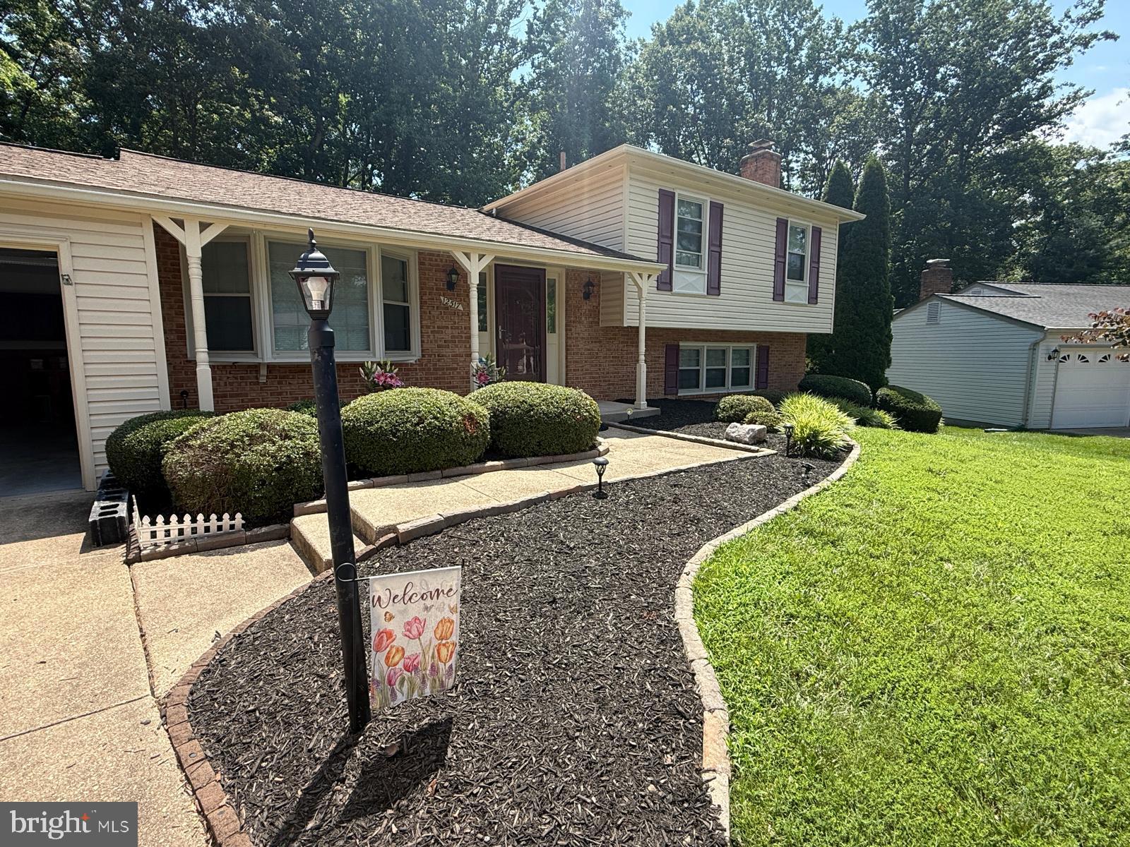 Gorgeous home in desirable Lake Ridge, loaded with updates. Both Bathrooms, kitchen, flooring, doors, roof, siding. Located on the friendliest street and right on the cul-de-sac, the front porch offers a lovely place to relax and unwind after a long day at work. A short walk or one stop light away is a Giant grocery store and Starbucks along with several other stores and eateries. The fenced back yard is the real show-stopper here...a nice deck with screened gazebo and a slate patio overlooking more than four acres of HOA owned property. The heavy woods with old hardwoods provides so much privacy you have to work to see the homes behind you in the spring and summer. Beautiful hardwood floors grace the main level, stairs and upper hallway. The main level has a wonderful light filled flow from one room to the next. There is a large bowed picture window at the kitchen table space and walls removed to open the kitchen up. The bathrooms feature exquisite tile work and you won't find a cleaner home than this! The comfortable family room has a built-ins surrounding the brick fireplace with wood stove .Ground level windows provide light to this room and don't miss the small door to the huge concrete floored crawl space, tons of storage in here! The nice sized laundry room has cabinets and a closet and walk out to the slate patio. There is also a room located off of the laundry with a window that could be a great office or 4th bedroom. The master bedroom has windows on two sides and also in the en-suite. The rec-room and all of the bedrooms just got engineered flooring, no more carpet! Two more bedrooms on this level. Located in a fabulous school pyramid of Old Bridge elementary, Lake Ridge middle and Woodbridge high school, each school is located less than a mile from the home. The award winning community of Lake Ridge features 5 swimming pools, a spray-ground, fantasy playground, a private boat ramp, outdoor lighted tennis courts, basketball courts, many tot-lots, easy access to many grocery stores and Lake Ridge park and marina with a nine hole golf course, putt putt, and boat rentals. Many opportunities for clubs and activities and only 3 miles from I95.