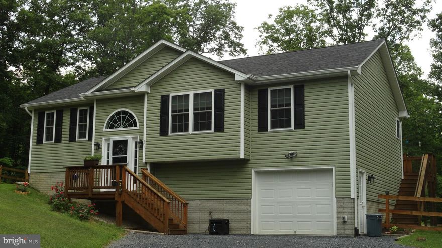 Perfectly PRIVATE location at end of Cul-de -sac.  Sit on the deck and enjoy the fenced backyard that backs to woods. This practically new home boasts many upgrades throughout including soft close kitchen cabinets, upgraded flooring, appliances and more.  Partially finished basement  is waiting for you to complete it and make it your own.  Community Lake--see docs more info