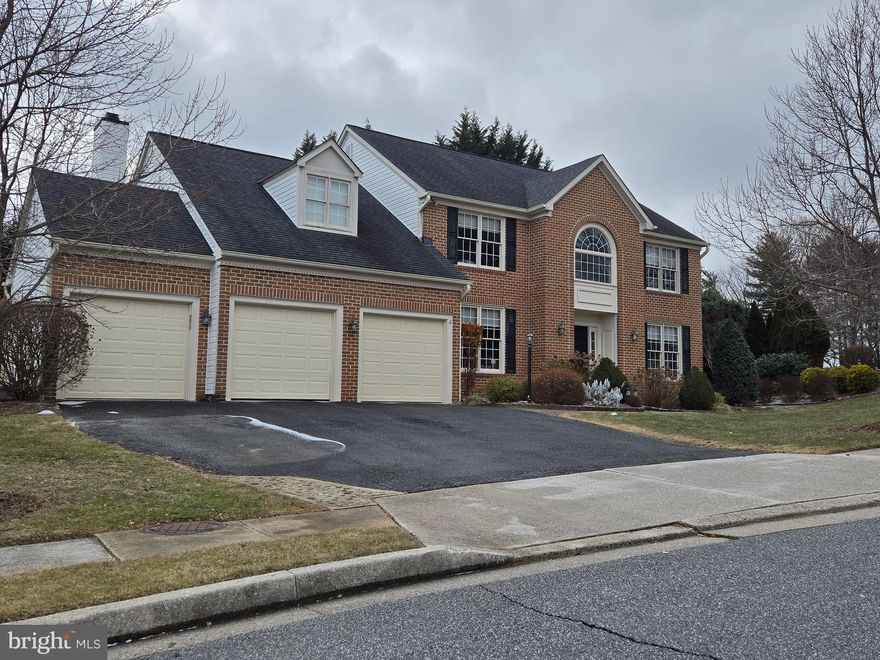 This stunning and beautifully updated 4 bedroom, 3 Full /1 Half bath, Center-Hall Colonial, is located in the coveted "Mayfair" community, on a large, corner lot. Three finished levels offer over 4600 sq ft of finished living space, plus unfinished basement storage rooms.  The traditional floor plan offers an airy, open and functional layout, with an inviting 2-story foyer, 9’ ceilings on the first floor, upgraded moldings, recessed lighting, hardwood flooring and lots of natural light. The recently remodeled kitchen and breakfast room feature recessed and pendant lighting, a marble topped island with room for stools, leathered granite countertops, marble subway tile and a coffee bar/dry bar with a wine fridge. Having a first floor Laundry Room is super convenient. The kitchen and breakfast room seamlessly flow into the newly carpeted family room, with recessed lighting, vaulted ceilings and a gas insert masonry fireplace. The adjacent sunroom has glass on 3 sides and doors to both a grilling deck and a large, open deck.  Upstairs you’ll find the primary suite, with two walk-in closets,  a gigantic remodeled bath with a sexy soaking tub, a separate WC, an oversized shower with multiple body jets and a marble topped, double sink vanity. There are 3 additional bedrooms and a remodeled hall bath with two marble topped vanities and a tiled tub-shower. The lower level is nearly fully finished with two huge family rooms, a full bath and ample unfinished storage spaces. Outside you'll find a lovely backyard with an oversized deck and huge side yard, ideal for entertaining. The siding just replaced in 2025.