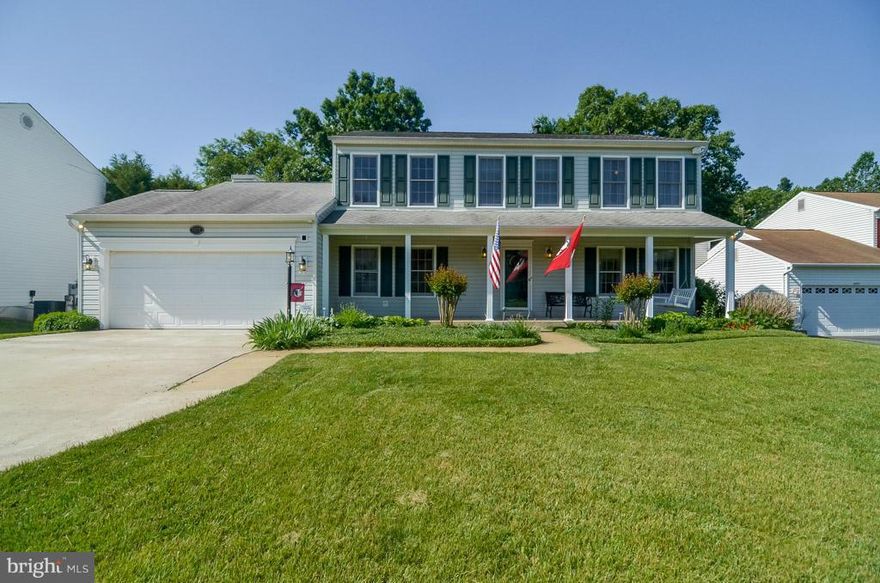 5 min. to VRE! Over 3000 sq. ft. on three finished levels with a w/o basement, huge deck, kitchen with stainless/granite/kit island, hardwood floors. Basement with theatre and screen conveys.  Picturesque fenced rear yard backs to stream/woods. Up-dated, roomy, functional and fun, this home has so much! Welcoming front porch, huge driveway, large lot and room to roam. Bring your pickiest clients!