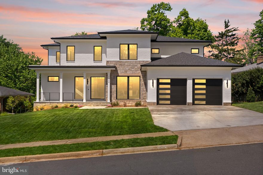 **Grand Opening Catered Open House this Saturday (5/2) 1-3pm and Sunday (5/3) 1-3pm** 

THE HOME EVERYONE'S BEEN WAITING FOR HAS FINALLY ARRIVED!!! A rare blend of bold design, functional luxury, and true multi-generational living—this brand-new contemporary Home in McLean Hamlet redefines what “move-in ready” should feel like. Designed by award-winning architect James McDonald, this 6-bedroom, 8-bath residence delivers striking architecture, seamless flow, and an elevated everyday lifestyle.
From the curb, the home makes an immediate statement. Crisp black trim contrasts against a refined mix of stone, brick, and soft stucco, while oversized windows flood the interior with natural light and create a seamless indoor-outdoor connection. Inside, soaring ceilings, open sightlines, and warm red oak floors set the tone for modern, inviting living.
The main level is built for both daily comfort and effortless entertaining. The sun-filled great room centers around a sleek modern fireplace and opens to a rear porch. The kitchen is a true showpiece—custom cabinetry, a waterfall quartz island, and top-tier appliances including double wall ovens, a 6-burner gas cooktop, and built-in refrigerator and freezer. A large walk-in pantry and dedicated dining area complete the space.
A standout feature is the main-level primary suite, privately located on the west wing of the home. Designed for multi-generational living, it offers comfort, privacy, and flexibility—ideal for extended family, long-term guests, or convenient main-level living.
The main level also includes a powder room, a functional mudroom with a built-in doggy shower, and access to the attached two-car garage. Two dedicated laundry rooms add everyday convenience for busy households.
Upstairs, four spacious bedroom suites surround a loft-style landing. The upper-level primary suite serves as a true retreat, featuring dual walk-in closets and a spa-inspired bath with a freestanding tub, double vanities, and a frameless glass shower. Not to mention the upper level primary suite has its own PRIVATE roof top terrace for a peaceful retreat. 
The fully finished lower level offers a walkout to the backyard, a sixth bedroom with full bath, an additional powder room, and expansive recreation space complete with a dedicated home gym and fully built-out Home theater, and a huge wet bar creating a true entertainment and wellness hub. 
With 7,487 finished square feet on a wide 0.3-acre lot, this home is as functional as it is beautiful. Thoughtful details—from custom millwork to the sunlit breakfast nook—enhance both comfort and style throughout.
Outside, the level backyard and spacious rear porch provide the perfect setting for relaxing or entertaining—ready to enjoy from day one.
Located in sought-after McLean Hamlet, this home offers privacy and convenience just minutes from Tysons, Langley, and Washington DC, with easy access to metro, shopping, and dining—all with no HOA!