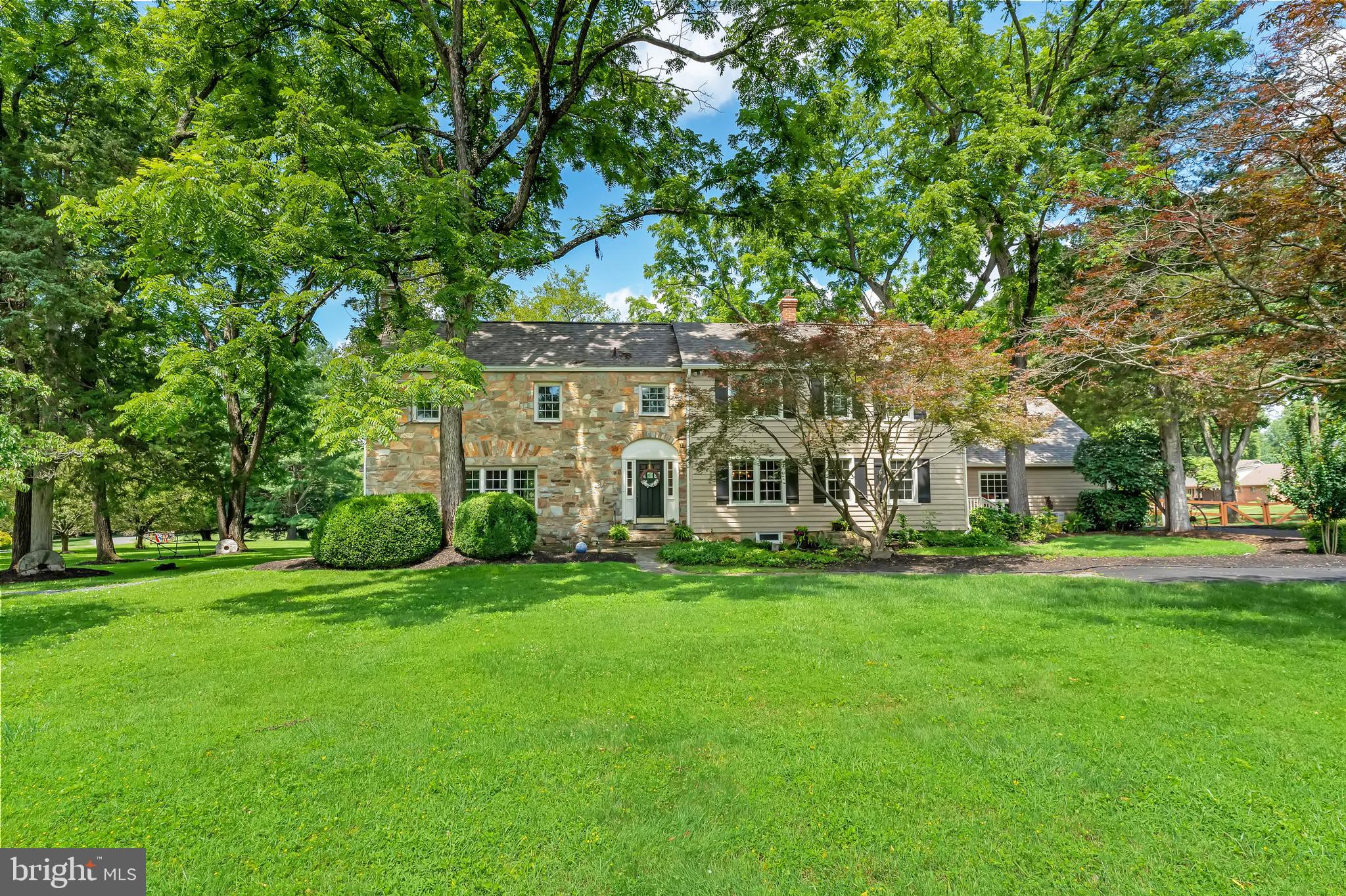 Stunningly upgraded 100-plus-year-old stone home with all the modern amenities. This home, filled with Old World charm, such as beamed ceilings, wide-width hardwood floors and a gorgeous stone wood-burning fireplace, has great updates such as an open gourmet kitchen with new cabinetry, stainless steel appliances, granite counters and pendant lighting. There are also two gas fireplaces, cathedral ceilings, a sunroom, gorgeous primary bath and a second fabulous en-suite bath. The owners have worked tirelessly to make this home special for some lucky new tenants. There is a beautiful entry foyer with hardwood floors, a large dining room with an old crystal chandelier and dental moldings. In addition to the fourth bedroom on the main level, there are two additional main level dens/offices/libraries for work-at-home convenience. The family room off the kitchen has built-in shelving around the fireplace and is filled with western light. The window-filled sunroom also faces the western rear yard and has French doors to the oversized two-level deck. The large room sizes reflect yesterday's era, as do the many other features such as multiple tall windows, crown molding, knotty-pine wood floors and two wooden staircases. The primary suite has its own gas fireplace, French doors, a walk-in closet and the attached primary bath with separate soaking tub and a shower with frameless glass. Bedrooms two and three are quaint large rooms with either a walk-in closet or a sitting area. The manicured lot is over one-and-a-quarter acres and grass cutting is included with the lease. Come and enjoy the luxurious care-free living of the past along with the relaxing comforts of today!!! Convenient to Downtown Fairfax City, the Beltway, Tyson's Corner and the entire Northern Virginia job market.
