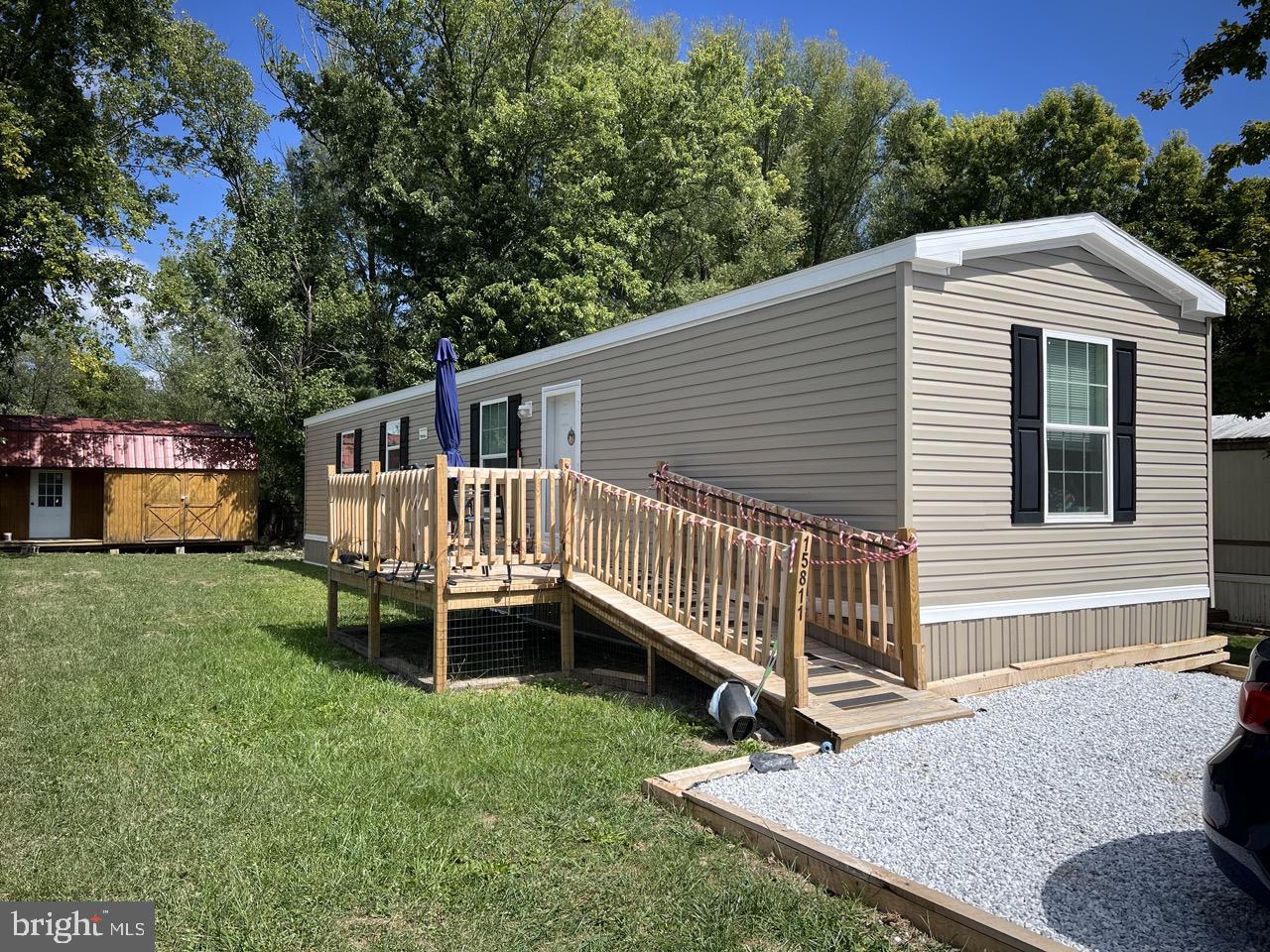 New 2024 14x60 Manufactured home with Central AC. 2 BR, 2 BA, Laundry room, front and rear decks. Take advantage of this mint condition, like-new home that has a transferable factory warranty. Low lot rent of $200 month in a great Rawlings location. Furnishings available at additional cost. Shed in back can be rented or purchased. Ramp to the main entrance. Enjoy years of maintenance free living with minimal upkeep. Great retirement or starter home. Pets allowed inside. Trash and sewer included in lot rent. Subject to park application/approval if home remains in Blooming Fields Mobile Home Park.