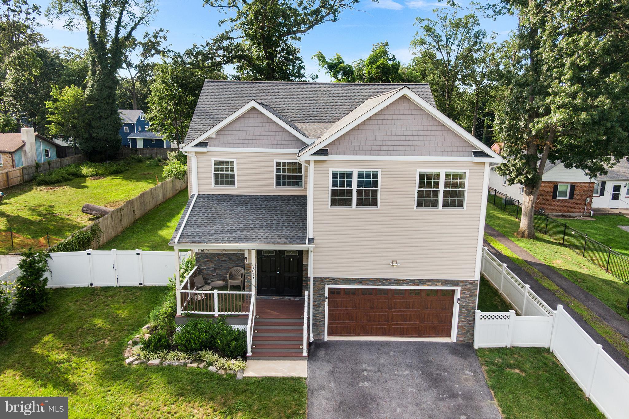Welcome to this stunning, nearly-new home located in the heart of Paoli and part of the award-winning Great Valley School District. Just a half mile to the Paoli SEPTA station and minutes from both Paoli and Main Line hospitals, this home offers unmatched convenience, modern elegance, and thoughtful design throughout. Enter onto the charming covered front porch and into a spacious foyer where you're immediately greeted by gleaming hardwood floors that flow seamlessly across all three finished levels. The main level boasts an open-concept layout that is perfect for both everyday living and entertaining. The sun-filled living room features sliding doors leading to a large rear deck, while the breakfast nook offers a cozy bay window for your morning coffee. The heart of the home is the chef-inspired kitchen, which features an oversized island with seating, abundant cabinet and counter space, a walk-in pantry, stainless steel appliances, gas cooking, a beautiful tile backsplash, and a stylish tile floor. Just off the kitchen is a formal dining room—perfect for hosting holiday dinners or special gatherings. Also on the main level, you'll find a convenient half bath, a large laundry room with utility sink and access to the side yard, and an oversized 2-car garage with soaring ceilings. Upstairs, the spacious primary suite is a true retreat, offering ample natural light, dual walk-in closets, and a luxurious ensuite bath with a soaking tub, glass-enclosed tiled shower, and separate vanities. Three additional generously sized bedrooms—each equipped with custom California Closets—share a well-appointed hall bath with a tiled tub/shower combo. The finished lower level provides a flexible space for a rec room, home gym, playroom, or media center—tailored to your lifestyle needs. Continue outside to your private backyard oasis: an expansive fully fenced, flat yard with durable white vinyl fencing, perfect for outdoor fun or relaxation. Additional features include a tankless water heater and booster pump ensuring excellent water pressure on all floors, and numerous high-end upgrades throughout. This move-in ready home is the perfect blend of comfort, style, and location—ideal for today’s modern living.