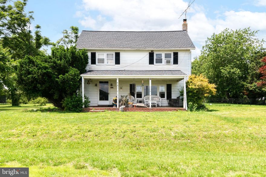 Step into country charm with this well-maintained 2-story colonial tucked away just west of Harrington. Originally built in 1880, it offers 3-bedrooms and a full bathroom upstairs, and a half-bath/laundry room combo downstairs. This farmhouse is over 2,000 square feet of living space on a peaceful corner lot. This home has a well laid out kitchen, with small dining room off to the side.  Enjoy a cozy living room with a propane fireplace, an enclosed back porch, and a beautiful open front porch. The detached garage is a standout feature—ideal for motorcycle enthusiasts, it doubles as a bar-style hangout or can easily be converted back to a 2-car garage. Storage isn't a problem with 2 additional sheds. Additionally fenced area provides space for your furry friend to roam safely. A brand-new roof completes this solid and inviting home. Seller is willing to sell additional parcel behind home ;  .27 acres, 2 bed 1 bath singlewide, detached garage.