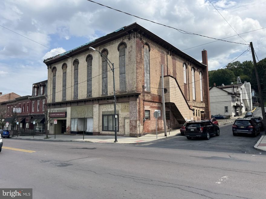 Located on Rt 54 in business section of Ashland. Multiples use Building.  Fine Wine and Good Spirits lease is part of sale. The rest of the building is up to you. Off Street parking in rear. Building does need work.