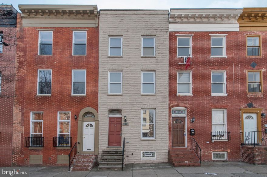 Out-of-State Seller. Must Sell!! Special Program! 2.65% Financing Available!!* Over $120,000 in Improvements Invested in Total Gut Renovation 10 Years Ago. Appraised for $195,000 in 2017. Owner is Liquidating Portfolio and this is the Last Property.  Now Additional 21K Price Drop! You will Love this Home!! 4 Finished Levels, High End Finishes, & Great Open Layout. Main Floor alone has Gorgeous Hardwood Floors, Gas Fireplace, Half Bath, Crown Molding and Recessed Lighting. Plus, Dueling Beautiful, Exposed Brick Walls Flowing Upstairs to Master Bedroom Level and Downstairs to Finished Lower Level.  Large Open L Shaped Kitchen Perfect for an Avid Chef with Granite Counters, Lots Of Cabinets and Updated Finishes! 2nd Floor Master Bedroom with Vaulted Ceiling, Exposed Brick & Huge Double Wide Closet Across from Dream Bathroom w/ Jacuzzi Soaking Tub, Stand Up Shower and Large Vanity! Two additional Huge Bedrooms on the 3rd Floor with Big Closets, Comfortable Layouts and Lots of Light. New Carpet and Freshly Painted Throughout!  Bonus Finished Basement is Perfect for Office, Workout Room or Flex Space. Wide Covered Backyard BBQ Deck Off Kitchen and Privacy Fenced Backyard Ideal for Entertaining. Located in Fantastic Location in Booming Hollins Market. One Block from Union Square Park and Short Walk to Heart of Hollins Market. Learn about Hollins Market Redevelopment and all the Exciting Things Happening in this Community!  1 to 1.25 Miles to Maryland Bio Park, Camden Yards, and M&T Bank Stadium. Do Not Miss Out!! Get Up to $18,500 in Grants! Located in University of Maryland's LYNW Grant Area!