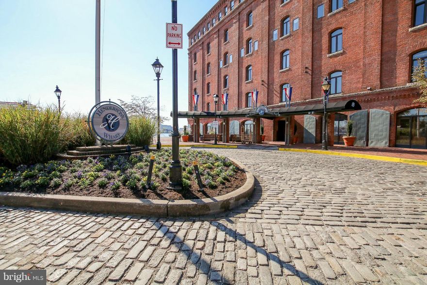 Spacious updated water front 2 Bedroom, 2 bath & den penthouse w/ FP,  in Historic Fells Point. Large balcony w/ long views of the harbor. Over 2200 square feet of light filled living space, exposed brick walls, updated kitchen & baths, granite counter tops,stainless steel appliances, hardwood floors throughout,spa bath. A rare opportunity in Henderson's Wharf Condominiums.