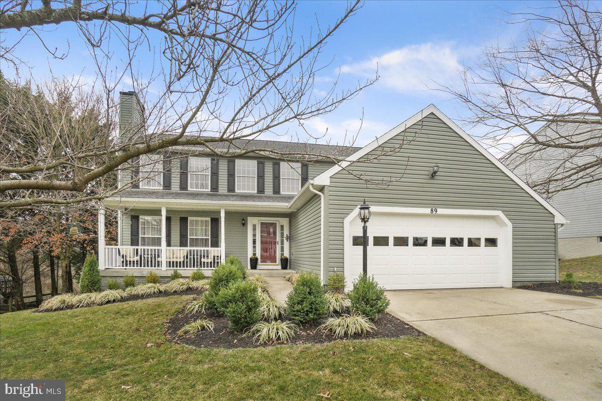 Here's your chance to own one of the nicest homes in sought after Ashley Hills! This center hall colonial contains beautiful built-in bookcases, elegant woodwork and custom hardwood flooring throughout. Entering into the soaring 2 story foyer, you'll appreciate all the natural light and custom crown molding. On your left is the formal living room/study containing cherry hardwood flooring. Shrug off the cold weather by cozying up next to a crackling fire from the wood burning fireplace. The owner has framed the fireplace with a full wall of exquisite wood paneling. On your right is the large dining room also containing beautiful cherry flooring and plenty of seating room. Continuing through the foyer you'll enter the spacious kitchen featuring beautiful cherry cabinetry w/ frosted glass doors, accent lighting and granite countertops. The kitchen also contains a separate eating area which opens to the family room. The family room features a magnificent built-in bookcase and quartered hackberry hardwood flooring. With warm weather right around the corner, the large rear deck is the perfect place for gathering and grilling! The views are pretty amazing also! Upstairs you'll find a huge primary suite w/ two walk-in closets. The recently remodeled ensuite bath contains a garden tub, separate shower and double sink vanity. Additionally upstairs, you'll find another recently remodeled full bath and three additional bedrooms all containing beautiful built-in bookcases. The lower level is an entertaining haven featuring a custom bar w/ a kegerator, mini-fridge, 2 tv mounts and ground level access to the rear patio to bring the party outside. Additionally, you'll find a 5th bedroom, 3rd full bath and large storage room with wall to wall shelving. Outside you'll find a stately landscaped yard with lovely flower beds all around. Oh, and don't worry about having a green thumb because the flower beds all contain perennial flowers! Behind this home there is a common area with direct access to a nature trail. Additional features of the community include more walking/biking paths, close proximity to town center/local events, commuter park-n-ride w/ commuter bus and access to major commuter routes. Homes in this community aren't offered for sale very often so don't miss this one!!