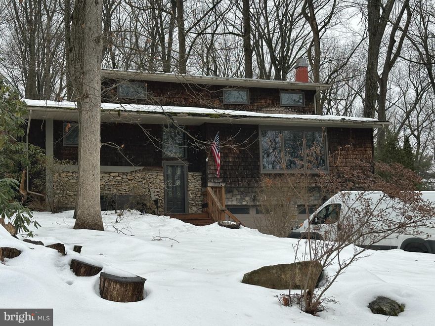 Professional pictures will be uploaded end of next week. Showings begin at the open house.
Do you want to feel like you live in your very own mountain house? Well you have found the perfect home! Nestled in a beautiful wooded setting on a cul-de-sac street, you are completely surrounded by nature  with Huge full length windows allowing for unobstructed peaceful views.   Each room on the first level is extremely spacious, offering multiple living options. Double sets of french doors allow for privacy if that is needed. There is a floor to ceiling lava rock propane fireplace in the front room,  a propane stove in the addition and a pellet stove in the basement. The basement also offers an additional hang out area, a powder room and garage access. The second floor has 4 very large bedrooms, one with an en-suite . Dual zone central air is another bonus!