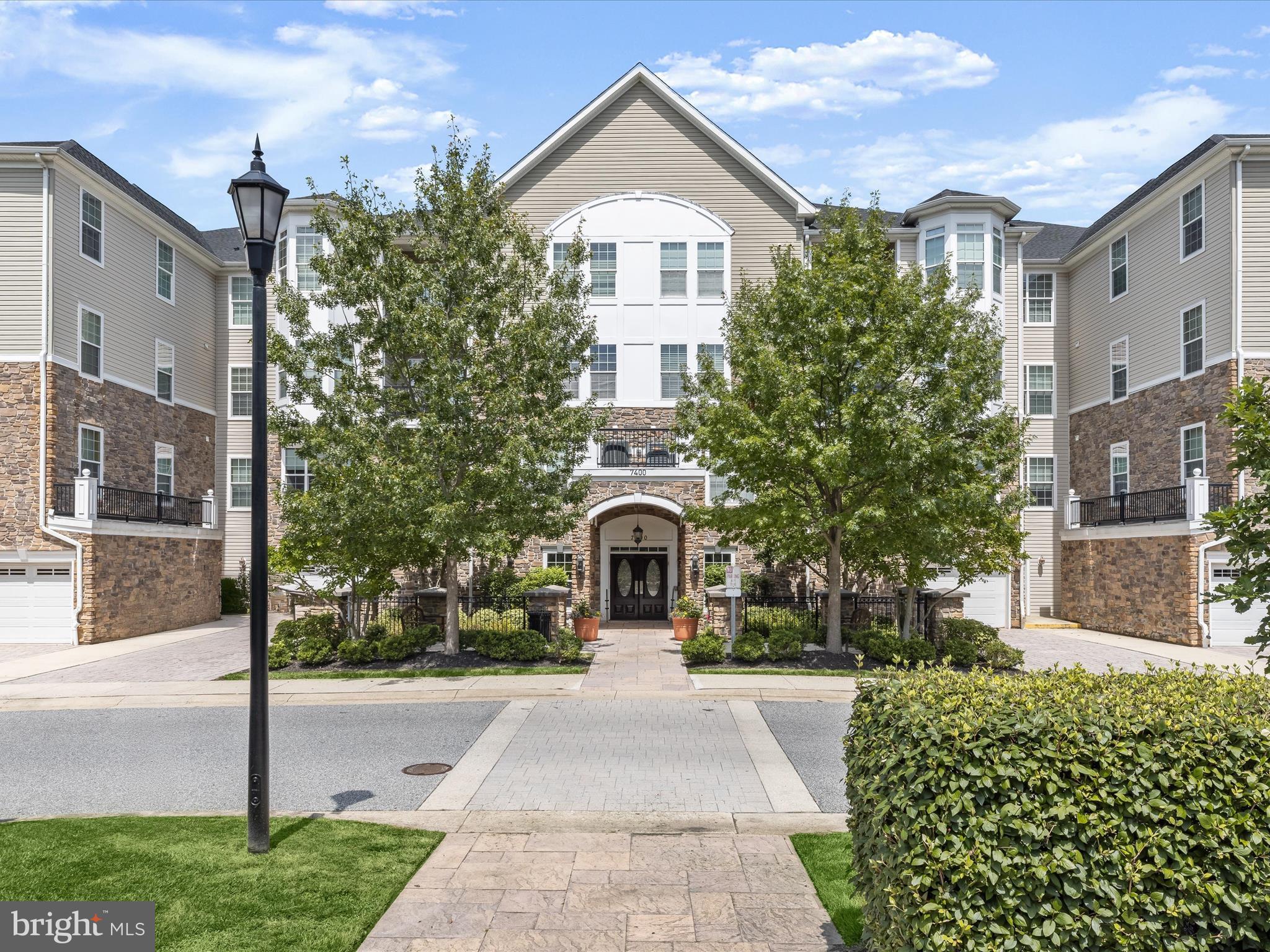Introducing this first floor condo featuring two bedrooms and two bathrooms in the sought-after Highlands at Quarry Lake. Designed with an open layout, a light neutral color theme, and high ceilings, this home blends comfort and style. Hardwood floors grace the living and dining rooms, while a den off the living room is the perfect spot for an office or lounge. The spacious eat-in kitchen boasts granite counters, 42” cabinets, stainless steel appliances, pantry, desk station, and a breakfast nook for casual meals. Retreat to the primary bedroom that includes a large walk-in closet, a second closet, and a private ensuite bathroom with a dual vanity and a walk-in shower with a bench. Located on the opposite side of the home for privacy, the second bedroom has built-ins and a large closet, while the second bathroom has a tub shower. Completing this unit is a laundry room and several storage closets. Enjoy the convenience of a one-car garage with inside access, along with ample guest parking spaces. This gated community offers a secure lobby and residents have access to Quarry Lake’s top-tier amenities, including a clubhouse, fitness center, outdoor pool, tennis courts, and more, with scenic walking paths along the lake, shopping, dining, and entertainment just moments away. Some images have been virtually staged.