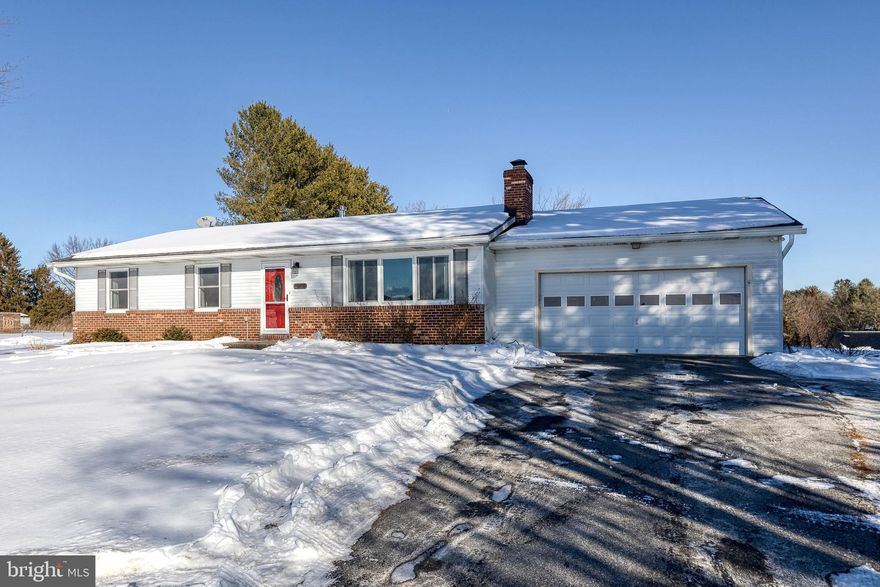 Welcome to this stunning rancher situated on over an acre of land with a spacious 2 car garage! Offering 3 bedrooms and 2 full bathrooms, this home features comfortable main-level living with thoughtful updates throughout.

Enter into the inviting living room showcasing recently updated laminate plank flooring that flows throughout the main level, along with all new Thompson Creek windows (2023). A charming brick-faced fireplace anchors the space and creates a cozy living space. The layout flows into the dining room and kitchen, creating an ideal setting for everyday living and entertaining.

The dining room includes a glass slider door leading to the rear yard, while the kitchen offers white cabinetry, stainless steel appliances, a new refrigerator and dishwasher (2021), and a brand-new induction stove (2025). The kitchen conveniently connects to the attached two-car garage, complete with a new garage door system (2023).

The main level includes a primary bedroom suite with a private full bathroom, along with two additional bedrooms and a second full bathroom. Bathrooms include one stall shower and one tub/shower combination, and all bedrooms feature ceiling fans.

The lower-level basement was recently finished in 2021 and adds valuable living space with a family room, bonus room, laundry room, and two storage rooms. The family room and bonus room feature luxury vinyl plank flooring and recessed lighting, and the bonus room includes an added closet, offering flexible use as a potential fourth bedroom, office, or playroom.

Outside, enjoy a large yard complete with a concrete pad (2023), two sheds, and play set, perfect for outdoor enjoyment. Additional upgrades include a new front door and storm door (2025), Class A fuel chimney lining with cap and storm collar (2020) and a water purification system (2021).

This move-in ready home combines functional living space, extensive updates, and a peaceful setting, don’t miss the opportunity to make it yours!