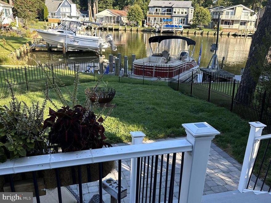 Step into the premier waterfront opportunity in Ocean Pines/Berlin. This home boasts an array of new
upgrades that enhance its charm and functionality, making it a must-see. Roof is only 3 years old; Electric service was upgraded within the last year and HVAC system is only 1 year old. In addition, a brand new water treatment was installed just 6 months ago.  The picture-perfect covered farmhouse porch invites you to relax and connect with neighbors strolling through the area. Inside, prepare to be impressed. With 4 bedrooms upstairs and a spacious first-floor owner's suite, totaling 5 bedrooms and 3 full baths, plus a conveniently located powder room near the foyer. The recently completed first-floor suite offers a private retreat with its own split-zone HVAC, luxurious oversized bath, and direct access to the fenced rear yard. Additional attic space provides ample storage. The heart of the home features a well-appointed kitchen with brand new appliances and a stylish butcher block top, seamlessly flowing into the adjacent dining room and cozy TV/living room parlor. A delightful sunroom off the kitchen leads to a rear deck, showcasing stunning views of the deep-water canal with quick access to deeper waters. The fenced yard ensures privacy, while shared dock access and space for a pontoon boat enhance waterfront living. Experience firsthand how this home caters to your family's needs and lifestyle. Schedule your visit today.