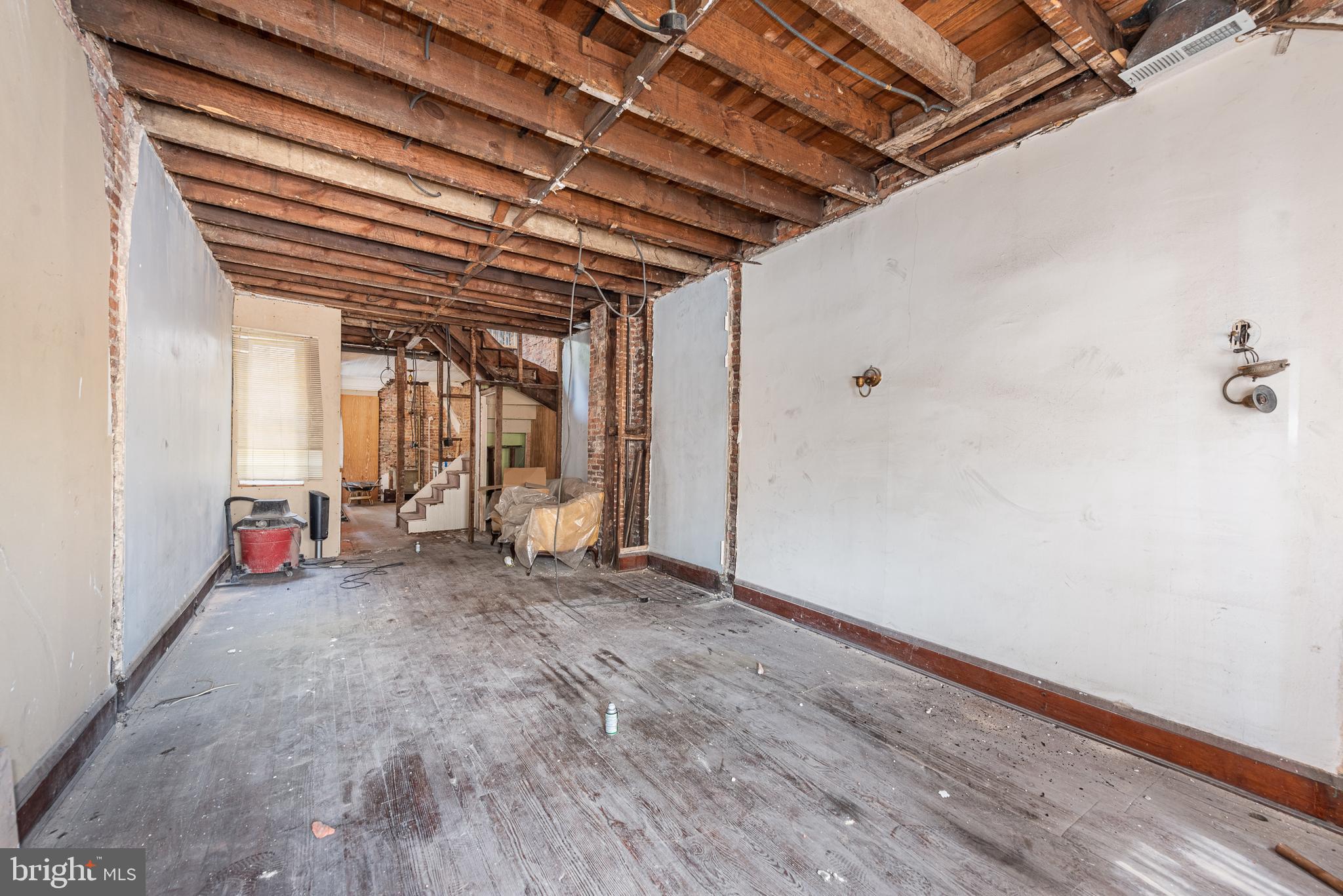 CALLING ALL BUILDERS!! PRIME REHAB OPPORTUNITY IN THE HEART OF CANTON! Perfect opportunity for a builder looking for their next rehab project. Over 1,100 sq. ft. of living space, unfinished basement with an outside entrance. Perfectly located close to the Can Company, Canton Square, and the waterfront. Sold As-Is!